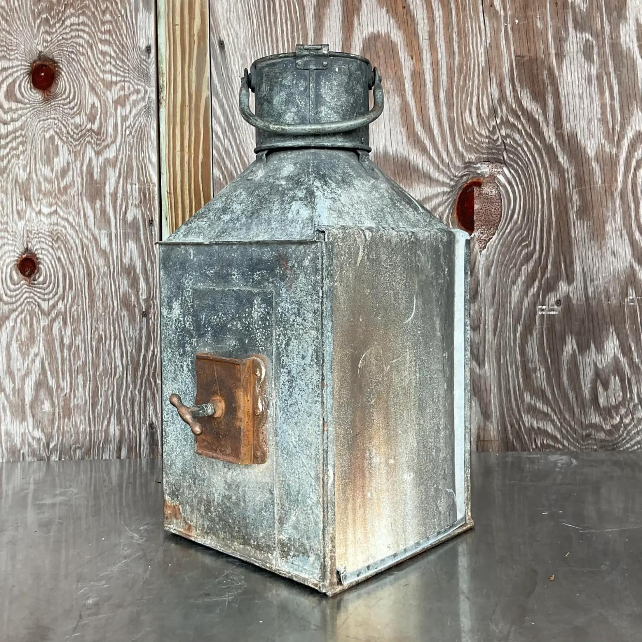 A fabulous vintage Boho ships lantern. Made by the iconic Meteorite group and marked on the top. Beautiful all over patinated finish on a metal frame. Thick glass lens. Acquired from a Palm Beach estate