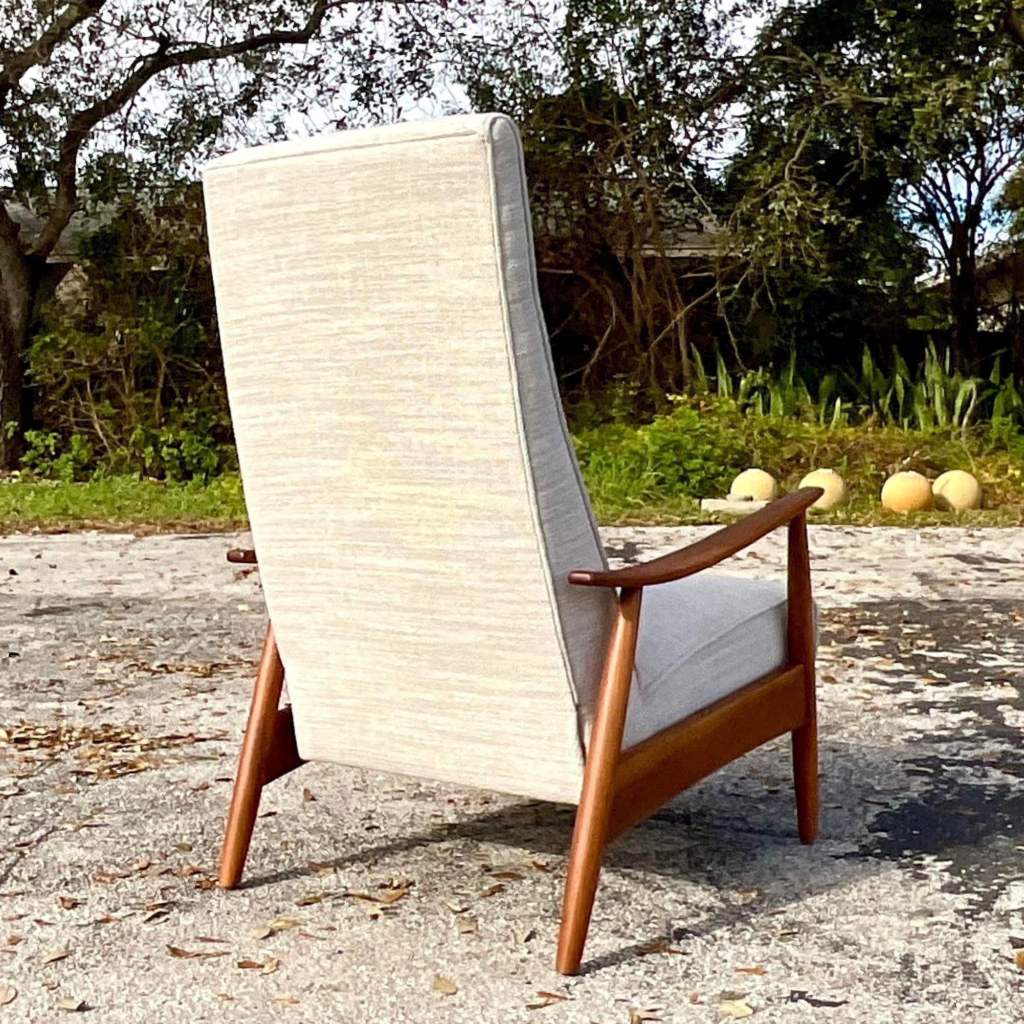 A stunning vintage Boho Reclining lounge chair. Designed by the iconic Milo Baughman for Thayer Coggin and tagged below. Beautiful pale grey upholstery in pristine condition. Acquired from a Palm Beach estate.