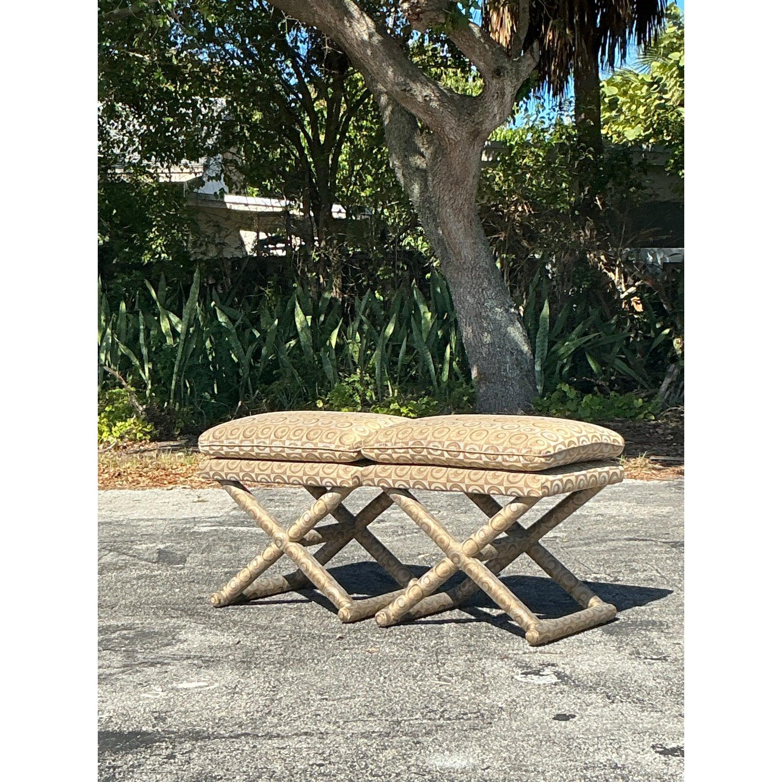 Add a touch of retro glamour to your space with this stunning pair of vintage boho mod X-benches. Featuring a bold geometric jacquard upholstery in warm neutral tones, these benches exude a sophisticated mid-century modern aesthetic. The sculptural