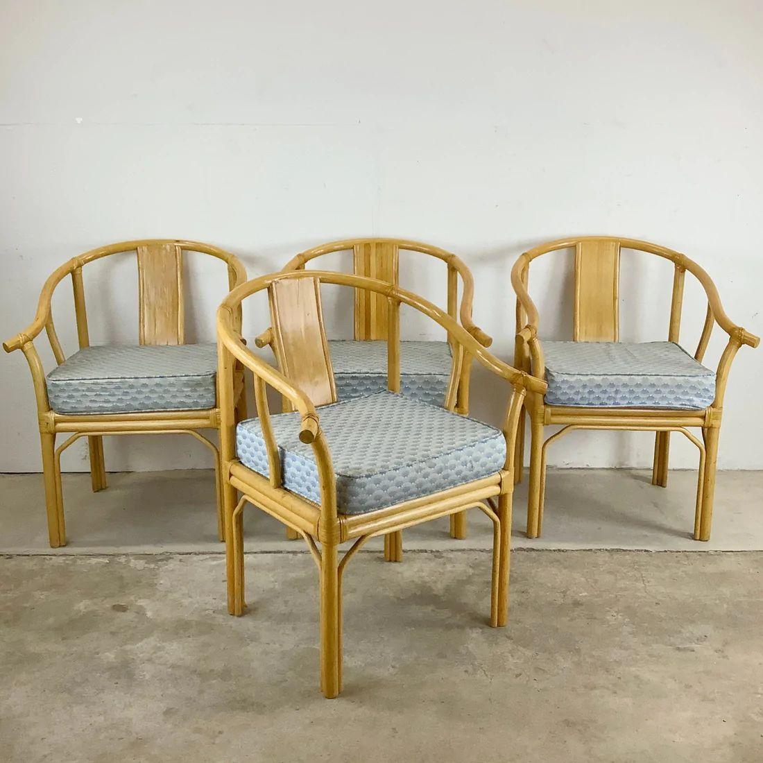 This sturdy and stylish set of four vintage modern armchairs feature bamboo frames with rattan seats and chinoiserie style design. Comfortable proportions and unique boho design make these perfect for regular use in a dining room, kitchen, waiting