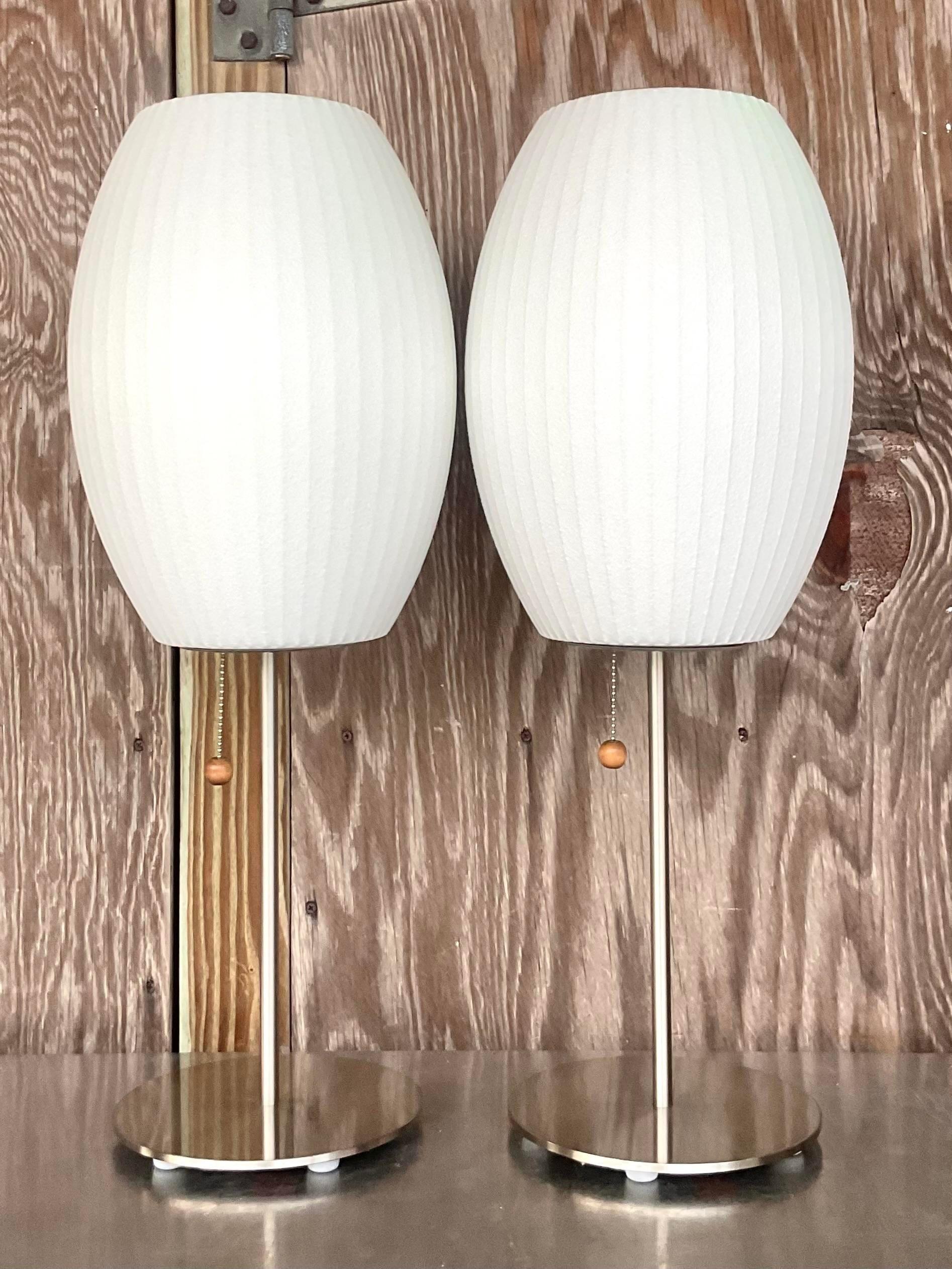 A fabulous pair of vintage Boho table lamps. Made by the LA based Modernica group. Their classic Bubble lamps after George Nelson. Tagged on the bottom. Acquired from a Palm Beach estate.