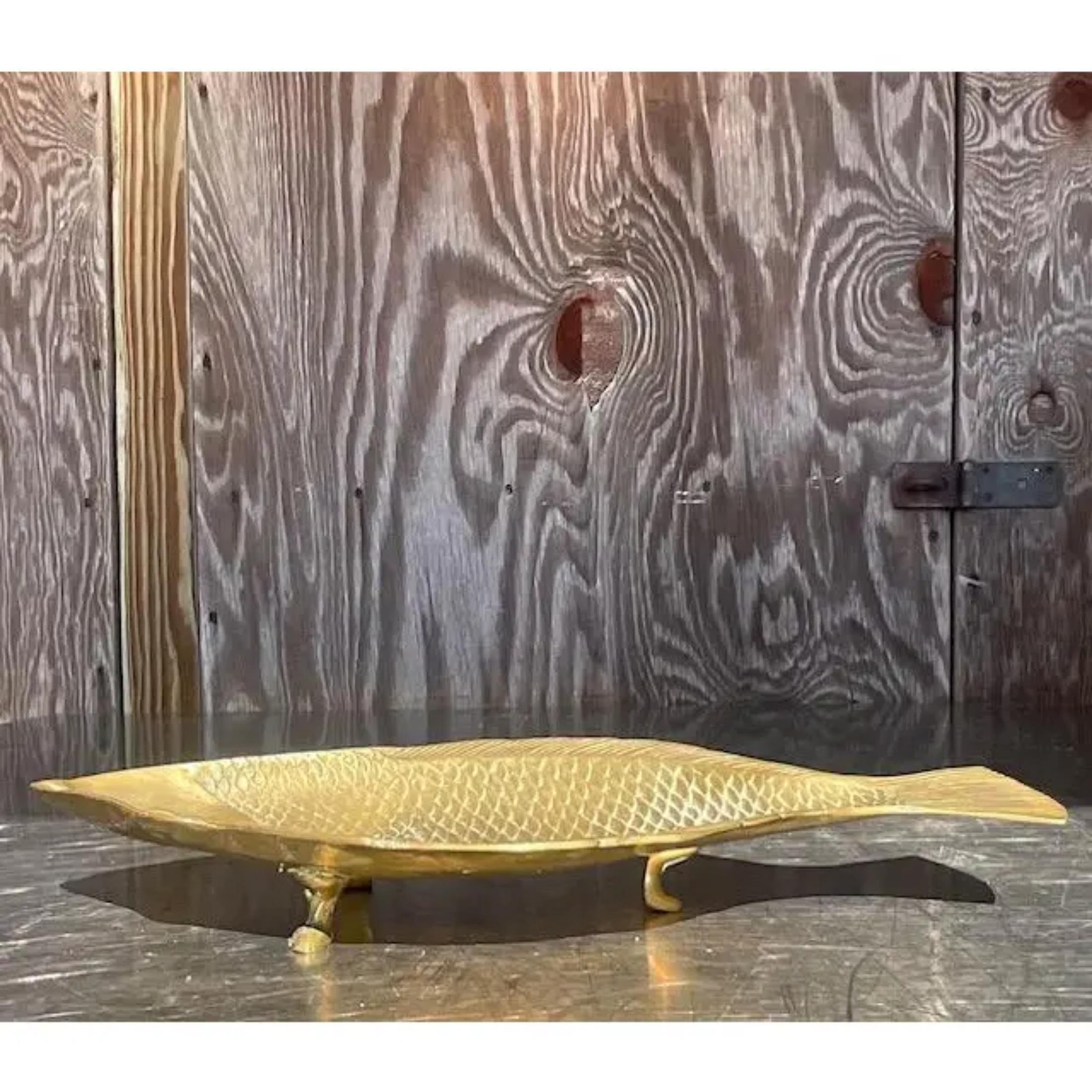 A fantastic vintage Coastal tray. A chic molded brass in a charming fish design. Perfect as a catch all or on your coffee table. You decide! Acquired from a Palm Beach estate