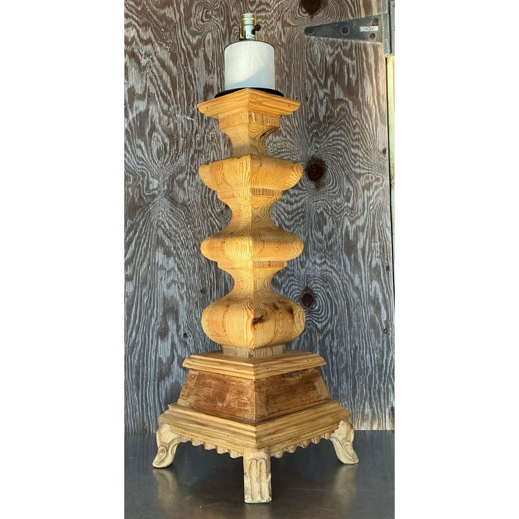Elevate your home decor with this stunning Vintage Boho Monumental Carved Pillar Lamp, a true testament to masterful craftsmanship and timeless style. The intricate hand-carved details and bold silhouette make this lamp a standout statement piece