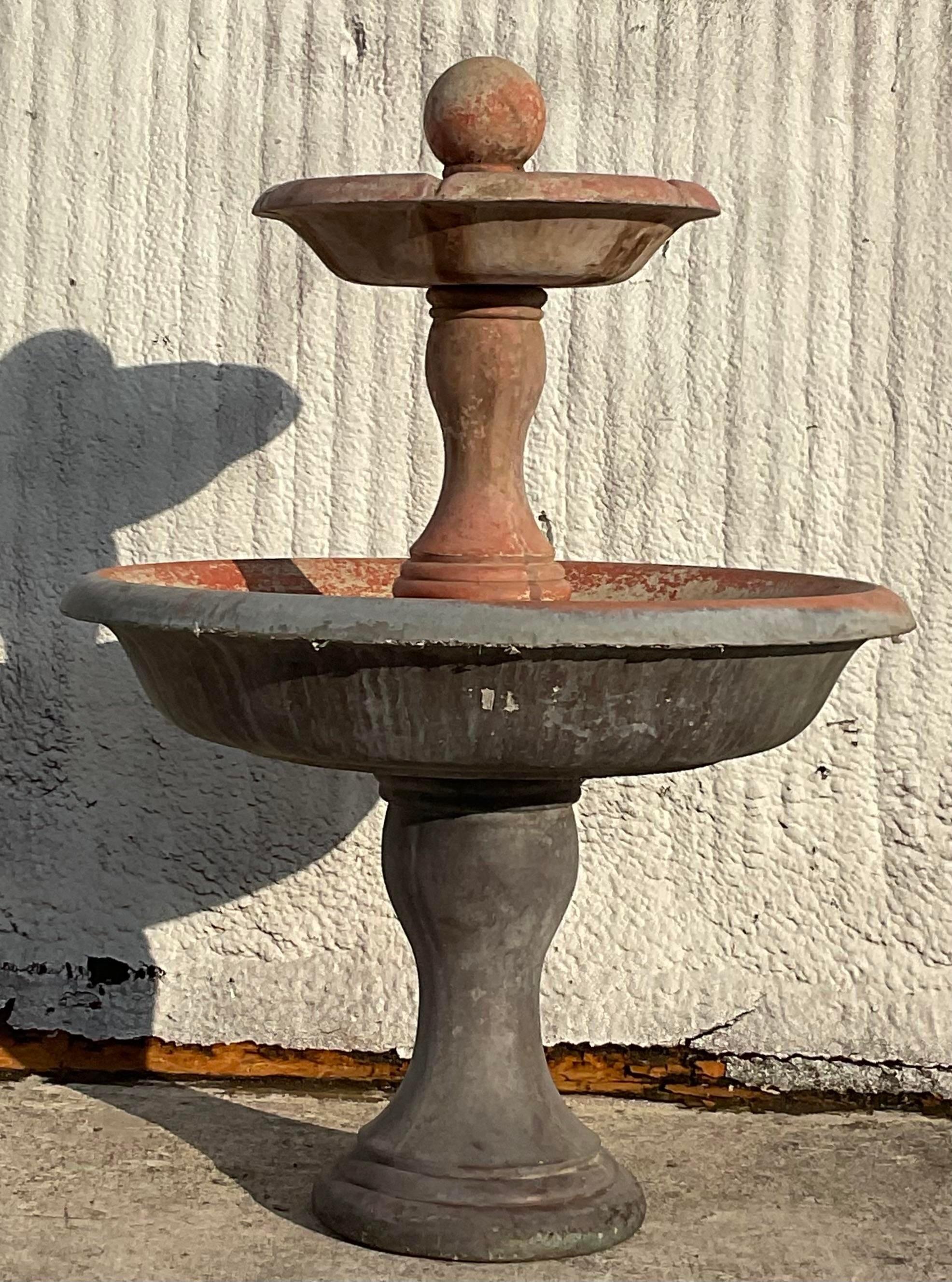 A fabulous vintage Coastal Outdoor fountain. Made from a cast concrete with a painted terra Cotta finish. Motor intact, but I have not tested it. Comes apart easily for transporting and set up. Acquired from a Ft Lauderdale estate.

Approx 175 - 200