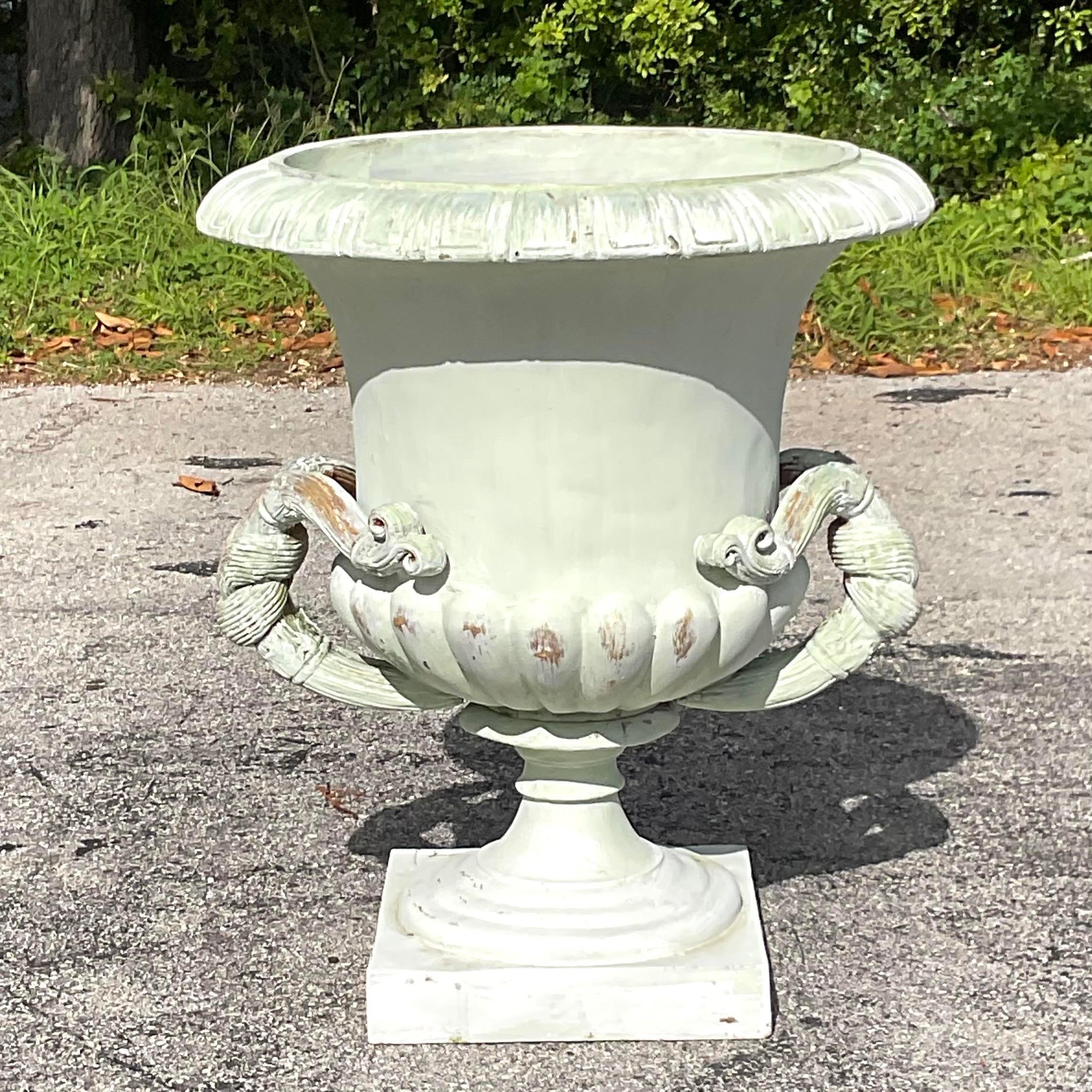 Elevate your space with the grandeur of our Vintage Boho Monumental Fiberglass Urn. Inspired by American ingenuity and Bohemian flair, this statement piece commands attention with its imposing presence and intricate detailing. Perfect for both