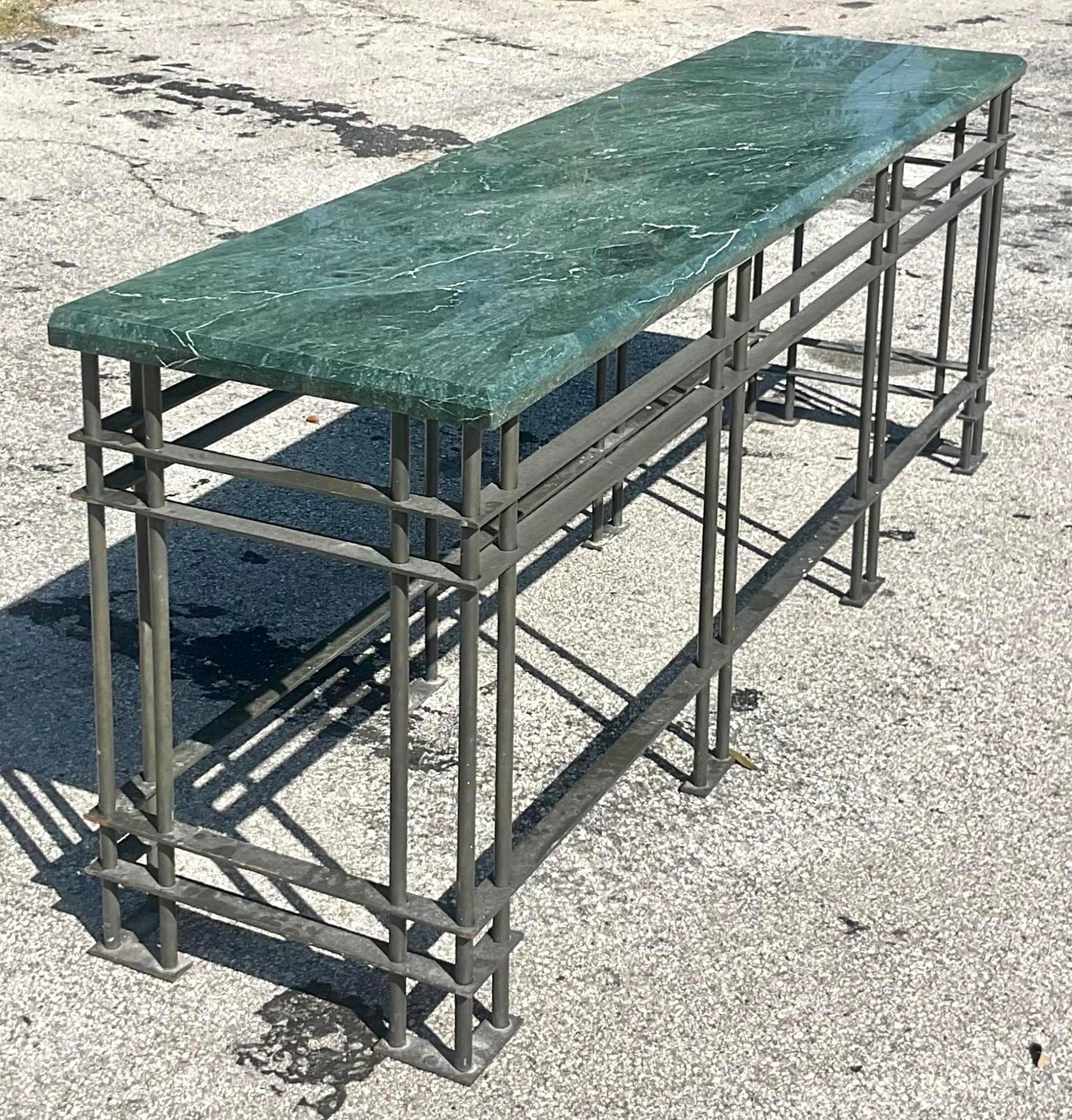 Make a statement with this Vintage Boho Monumental Console Table. Featuring a striking green marble top and a sturdy wrought iron base, it combines bold elegance with timeless boho flair. Perfect for adding a touch of grandeur to your space. Two