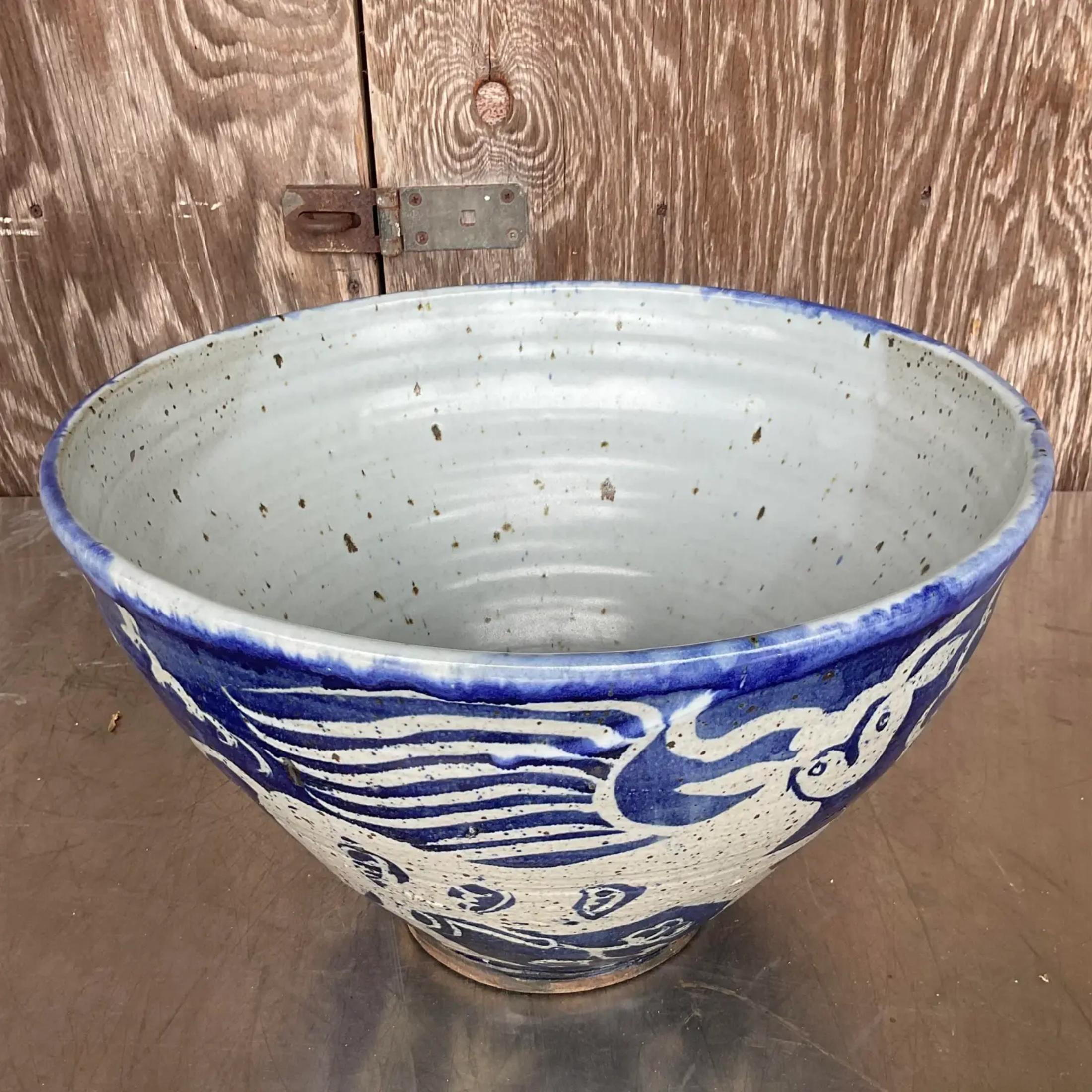 A fabulous vintage matte glazed ceramic bowl. A chic hand made terra Cotta piece with beautiful hand painted animals detail. Signed on the bottom. Acquired from a Palm Beach estate