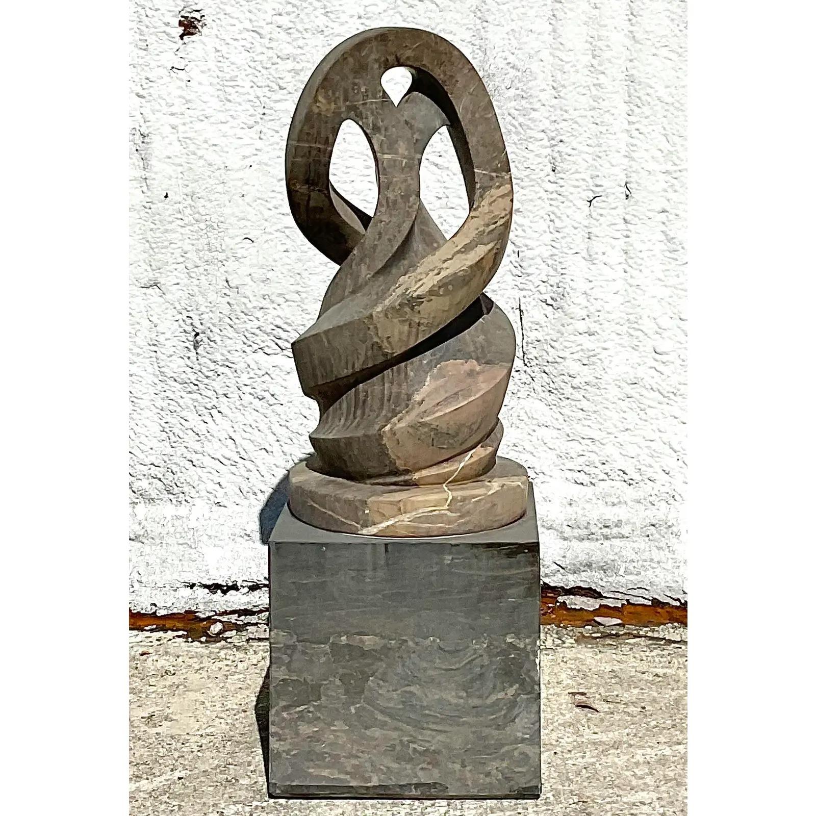 Incredible vintage Monumental Abstract sculpture. Beautiful intertwined hand carved marble in chic shades of pale grey and camel. Rests on a marble plinth. Perfect indoors or outside. You decide! Acquired from a Palm Beach estate.