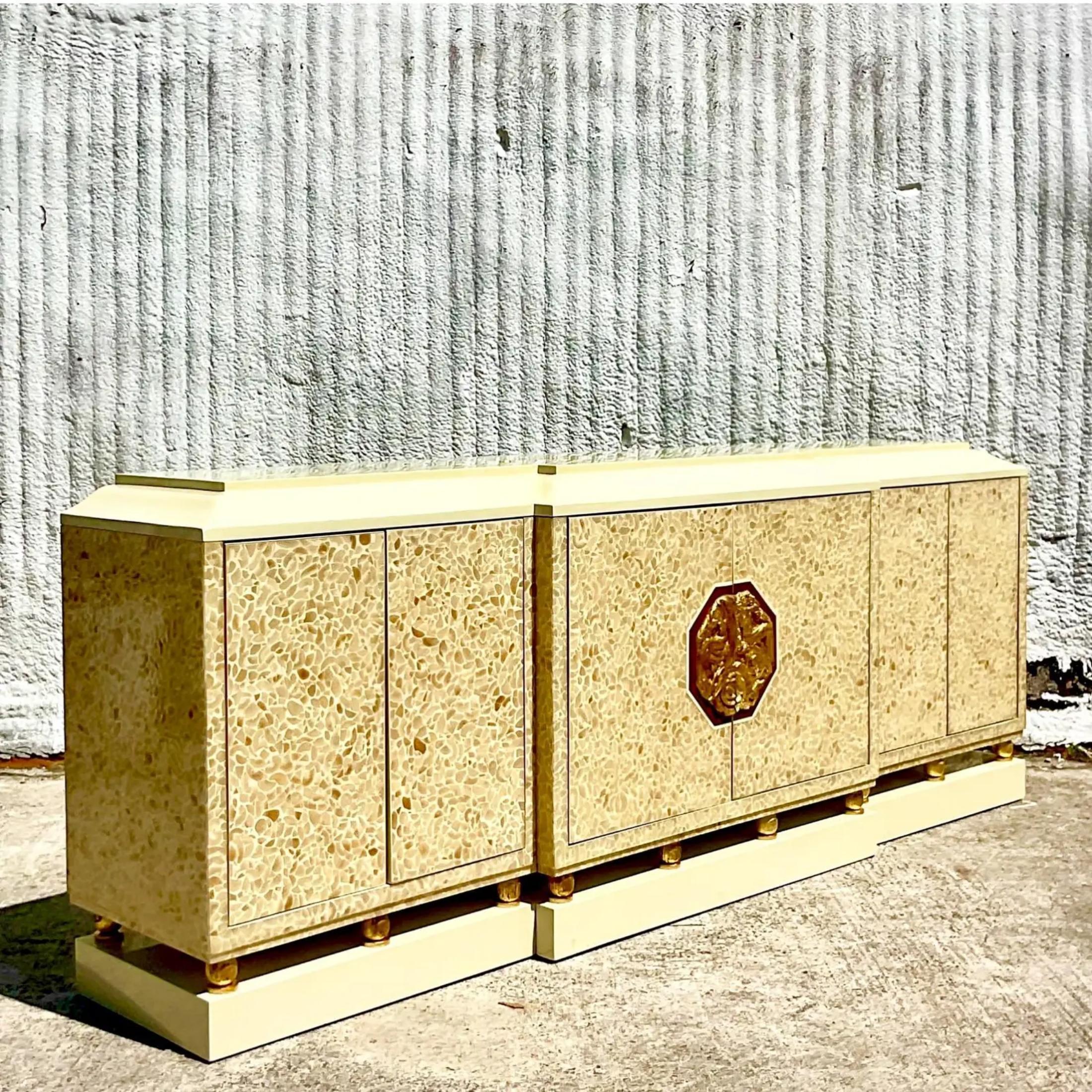 An extraordinary vintage Boho credenza. Made by the iconic Enrique Garcel and marked on the back. A chic lacquered cabinet with inlaid detail. Gold foil accents on the bottom. A stunning medallion center handle. Acquired from a Palm Beach estate