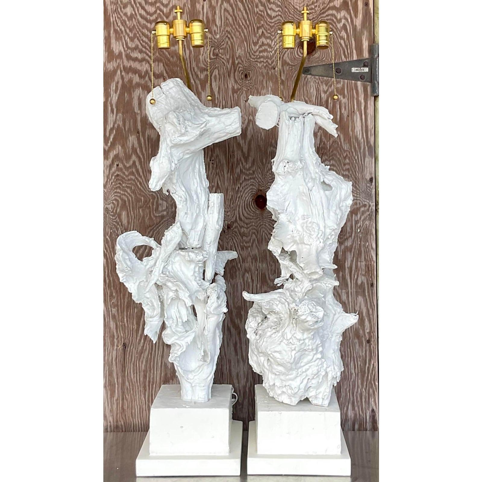 A spectacular pair of vintage monumental table lamps. Soaring painted driftwood on wooden plinths. Fully restored with all new wiring and hardware. Acquired from a Palm Beach estate.

The lamps are in great vintage condition. Minor scuffs and