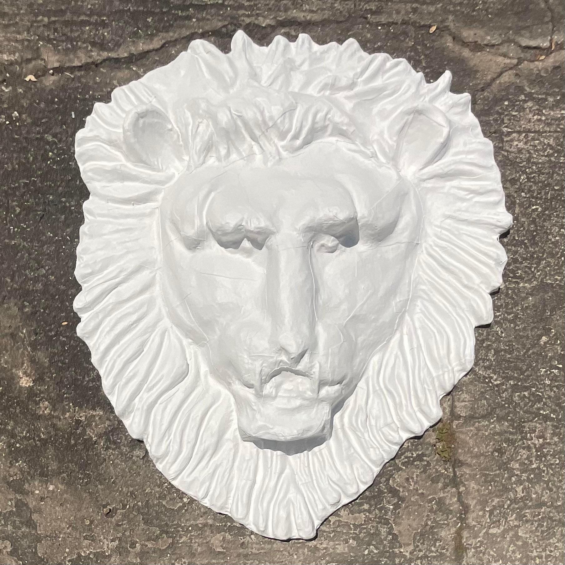 Add a regal touch to your space with our Vintage Boho Monumental Painted Leather Lion's Head. This stunning piece combines American craftsmanship with boho artistry, creating a majestic focal point that captures both boldness and bohemian allure.