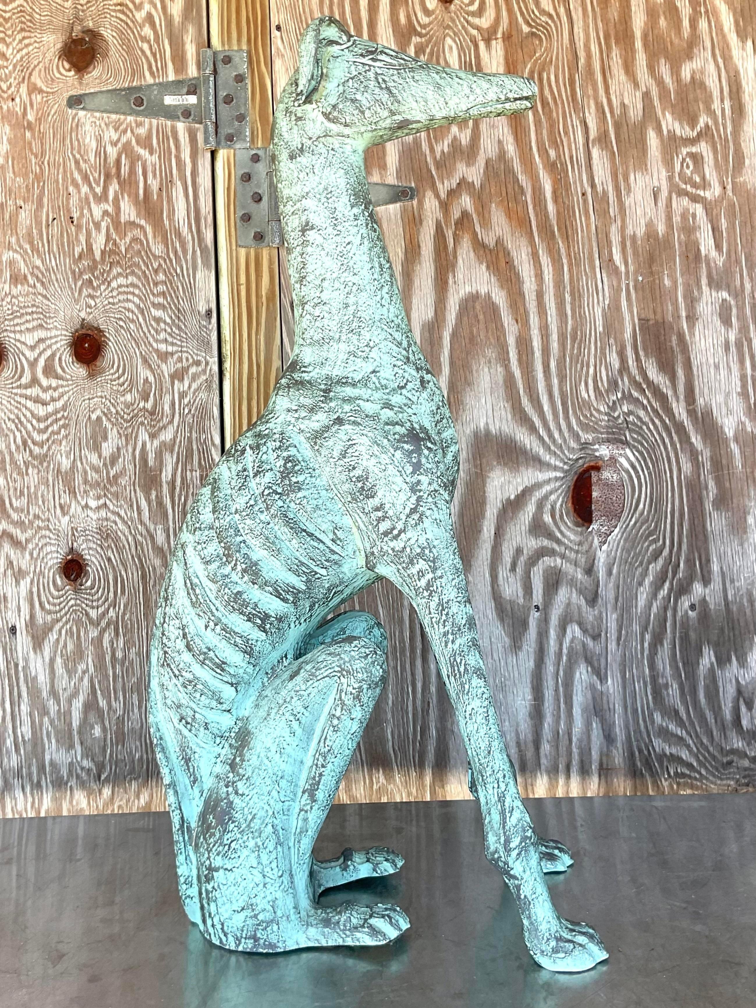 A fabulous vintage Boho dog. A chic Abstract plaster Greyhound with a patinated finish. Monumental in size and drama. Acquired from a Palm Beach estate.