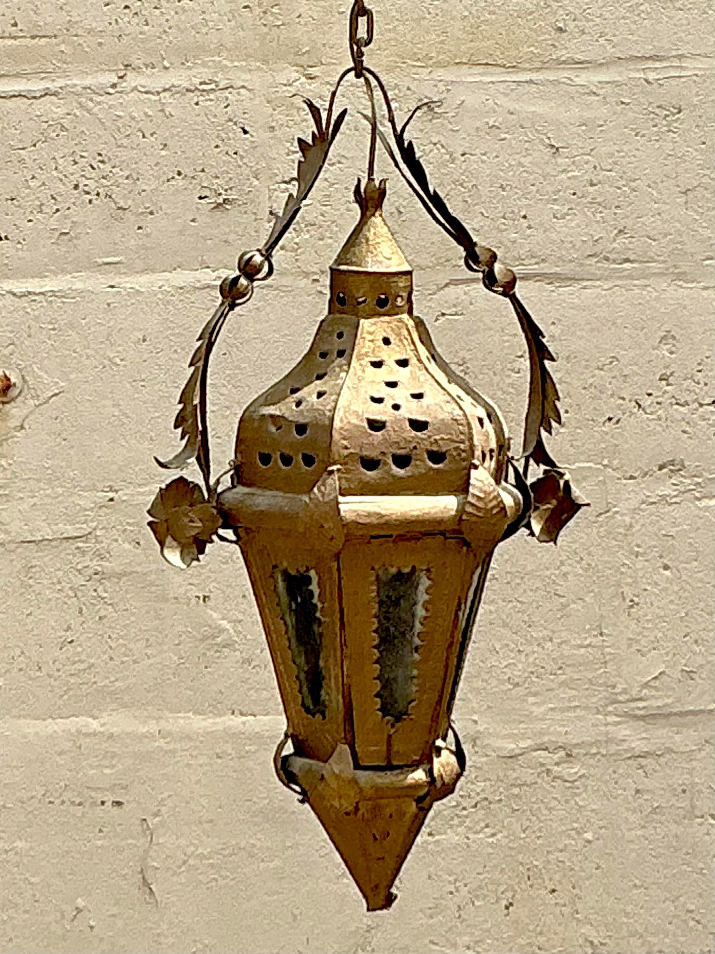 Embrace vintage charm with this Boho Moorish lantern, inspired by Addison Mizner's iconic American style. This exquisite piece combines intricate Moorish designs with a bohemian flair, perfect for adding a touch of timeless elegance to any space. 