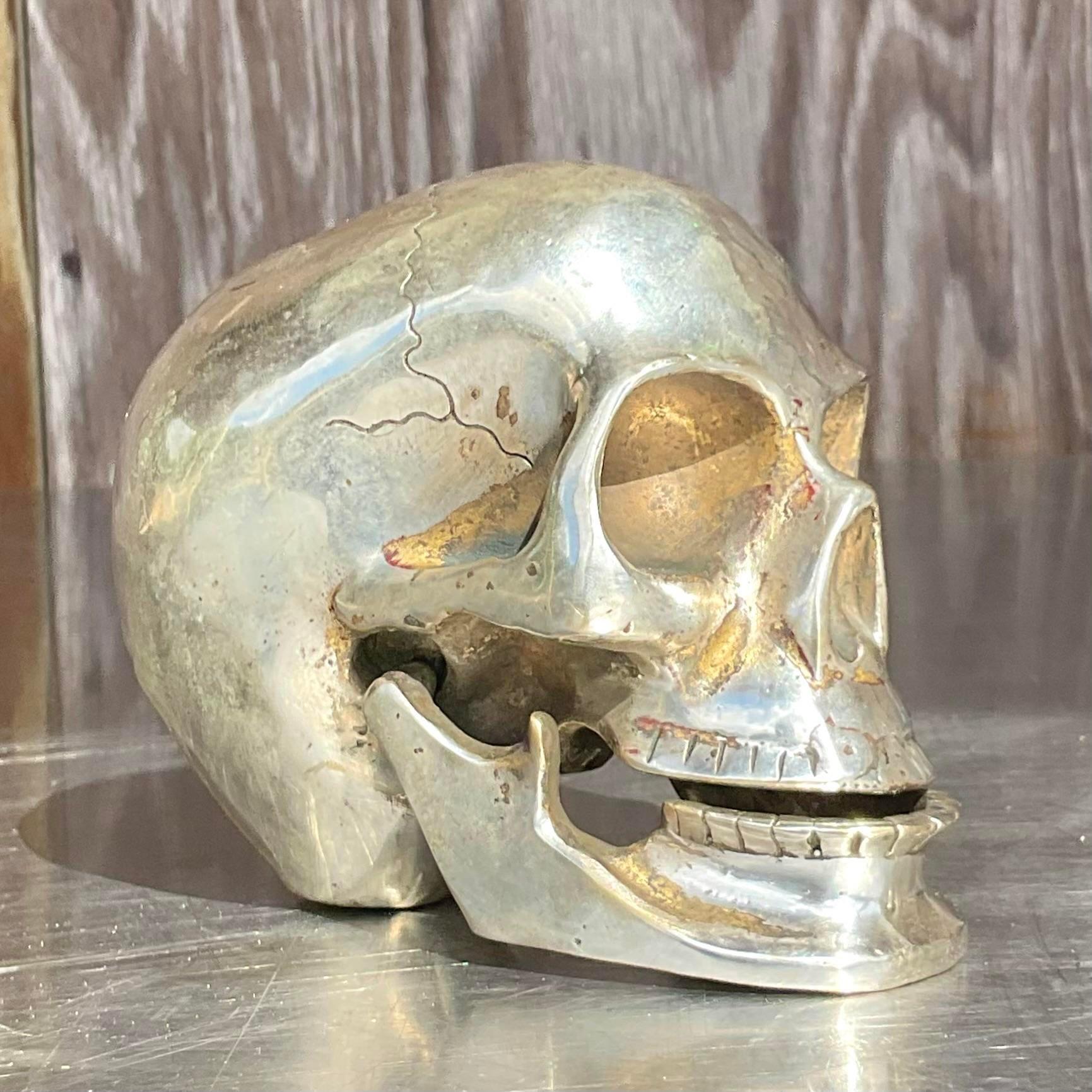 A fantastic vintage Boho metal articulated skull. A chic little piece with a nickel over brass finish. Perfect to add a little drama to your coffee table. Acquired from a Palm Beach estate.