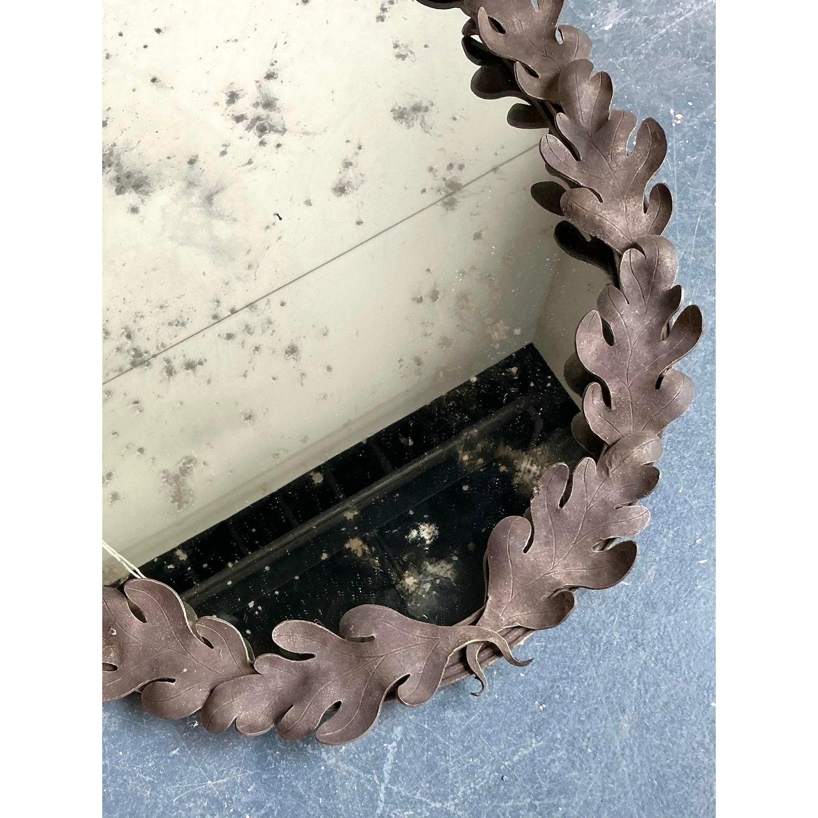 Adorn your walls with this charming vintage oval mirror, a piece that beautifully captures a blend of bohemian whimsy and natural elegance. The mirror features a captivating frame composed of intricately sculpted oak leaves, likely crafted from