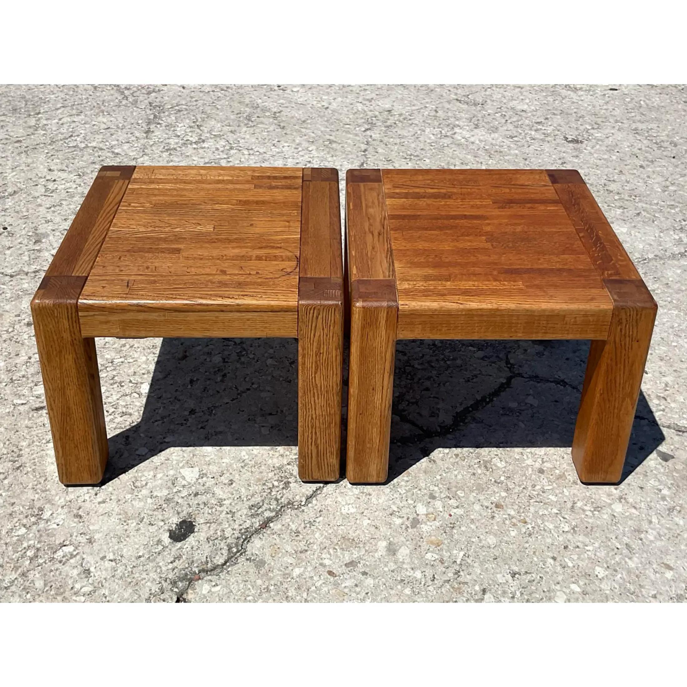 Fantastic pair of vintage Boho drinks tables. A simple and chic design constructed of a solid oak. Perfect as low side tables or movable drinks tables. Acquired from a Palm Beach estate