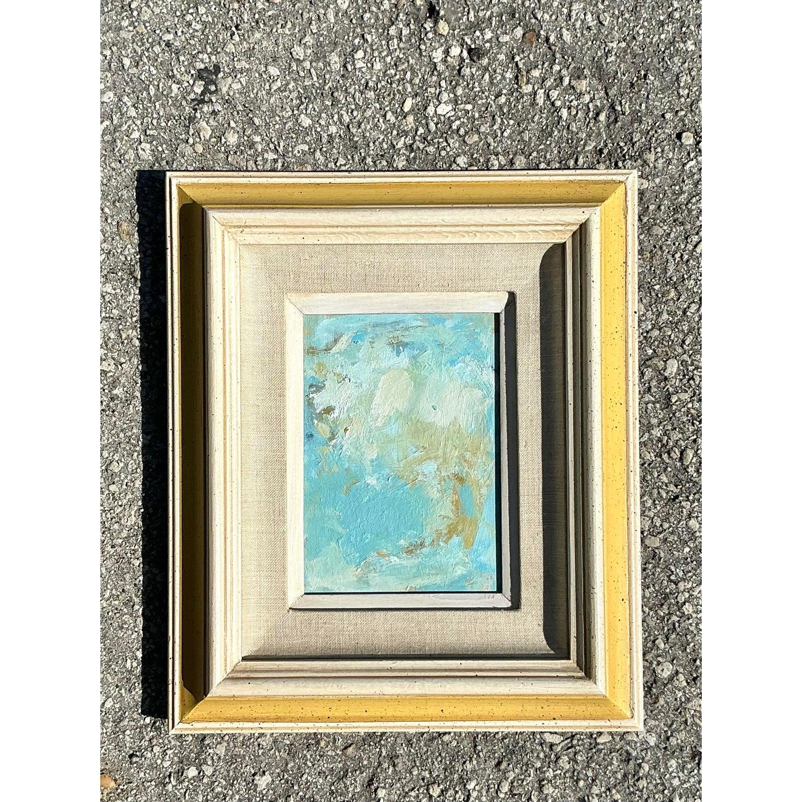 Dieses atemberaubende abstrakte Ölgemälde im Boho-Stil auf Karton verleiht Ihrem Raum einen Hauch von verträumter Farbe und faszinierender Struktur. Dieses kleinformatige Originalkunstwerk in einer ruhigen Farbpalette aus Himmelblau, Salbei und