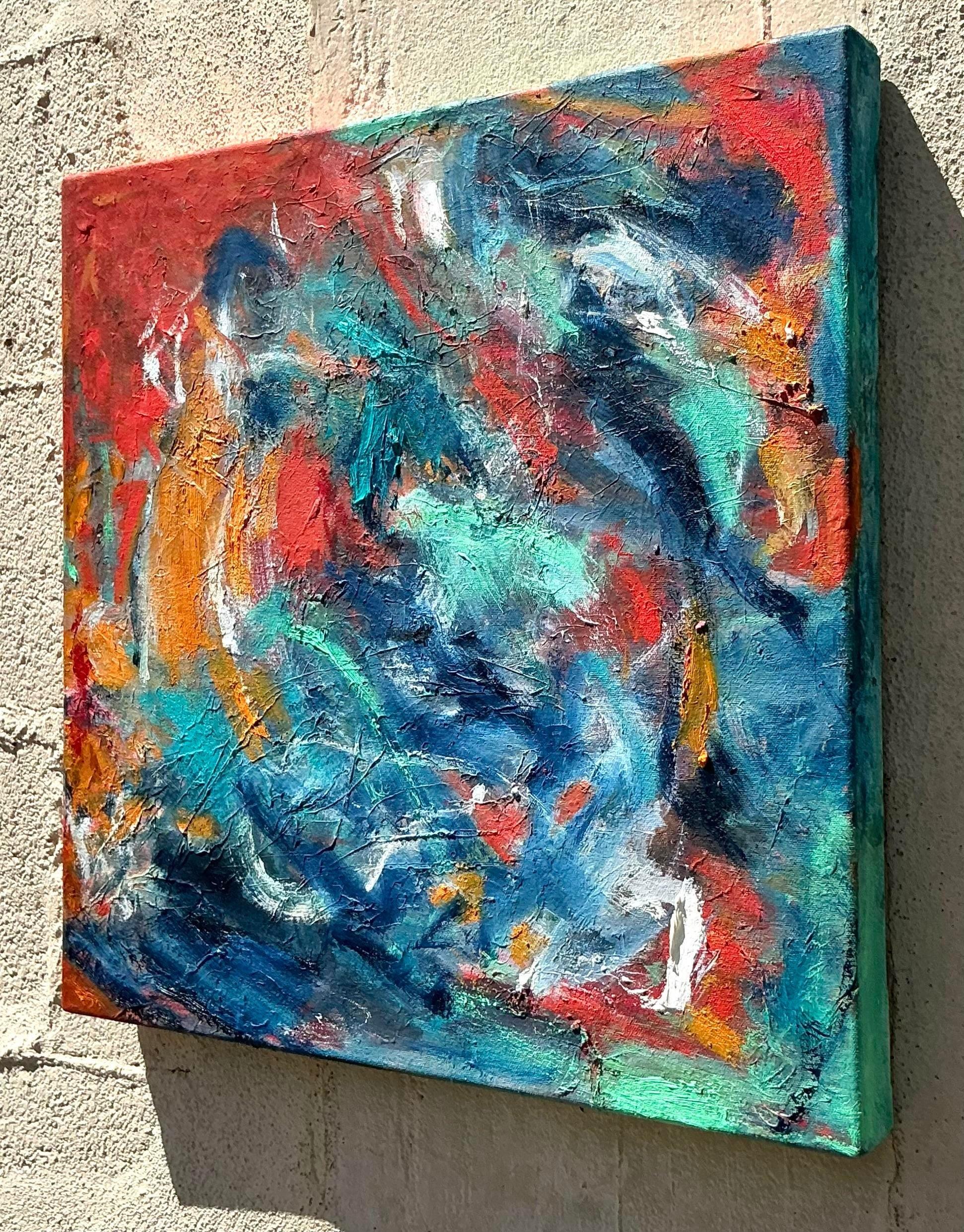 Dieses lebhafte abstrakte Ölgemälde im Boho-Stil auf Leinwand zeigt eine energiegeladene Mischung aus Farben und Texturen mit wirbelnden blauen, roten und orangefarbenen Strichen. Die kühne und ausdrucksstarke Pinselführung macht dieses Kunstwerk zu
