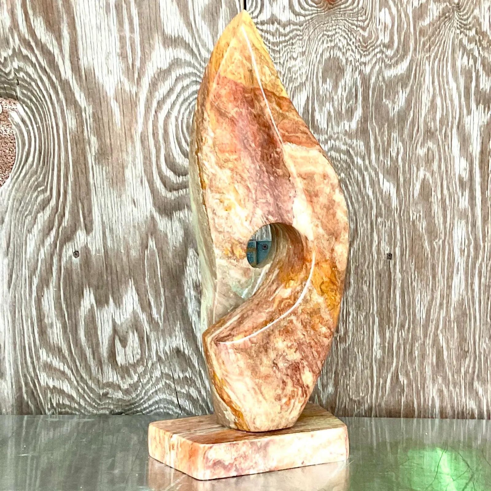 Incredible vintage Boho Original stone sculpture. A beautiful abstract composition made in a warm stone. Chic shades of orange and rust colors. Signed on the bottom. Acquired from a Palm Beach estate.
