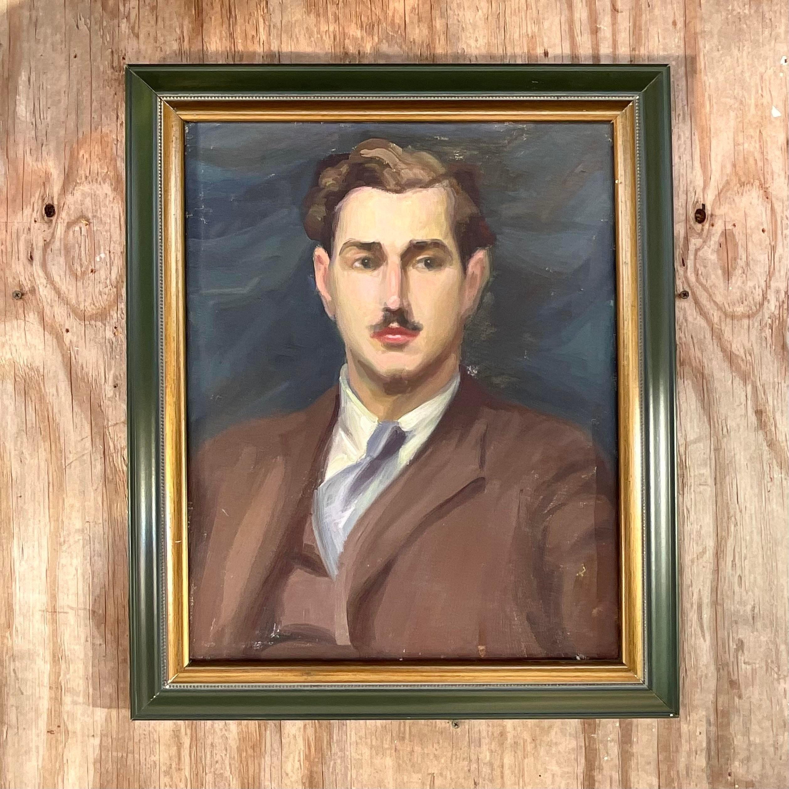 A fantastic vintage Boho original oil portrait on canvas. A chic composition of a handsome young man. A deep hunter green and gold frame. Acquired from a Palm Beach estate. 
