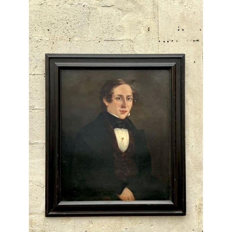 Infuse your space with the distinguished presence and captivating allure of this antique original oil portrait on canvas. The unknown artist skillfully captures the thoughtful gaze and refined features of a 19th-century gentleman, rendered in rich,