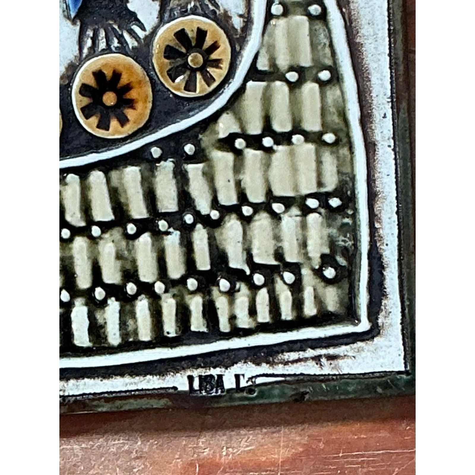 This exceptional collection comprises four vintage ceramic art tiles, each a masterpiece of textural high-relief studio pottery, exhibiting a strong influence of Scandinavian design from the Mid-Century era. Handcrafted with intricate detail, the