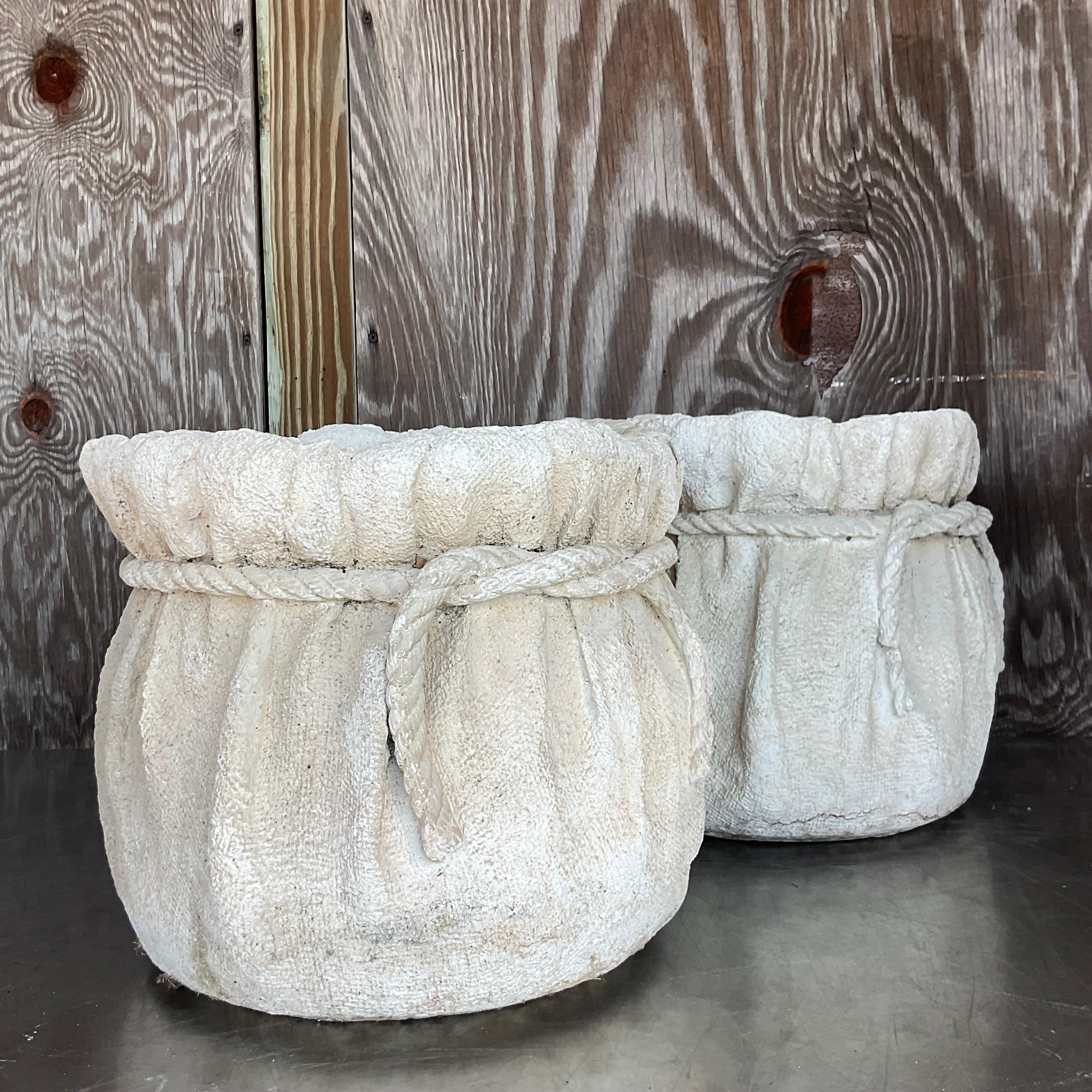 Elevate your greenery with a touch of bohemian charm and American craftsmanship! This pair of vintage painted terra cotta rope planters adds rustic elegance to any space. With their hand-painted details and natural textures, these planters bring a