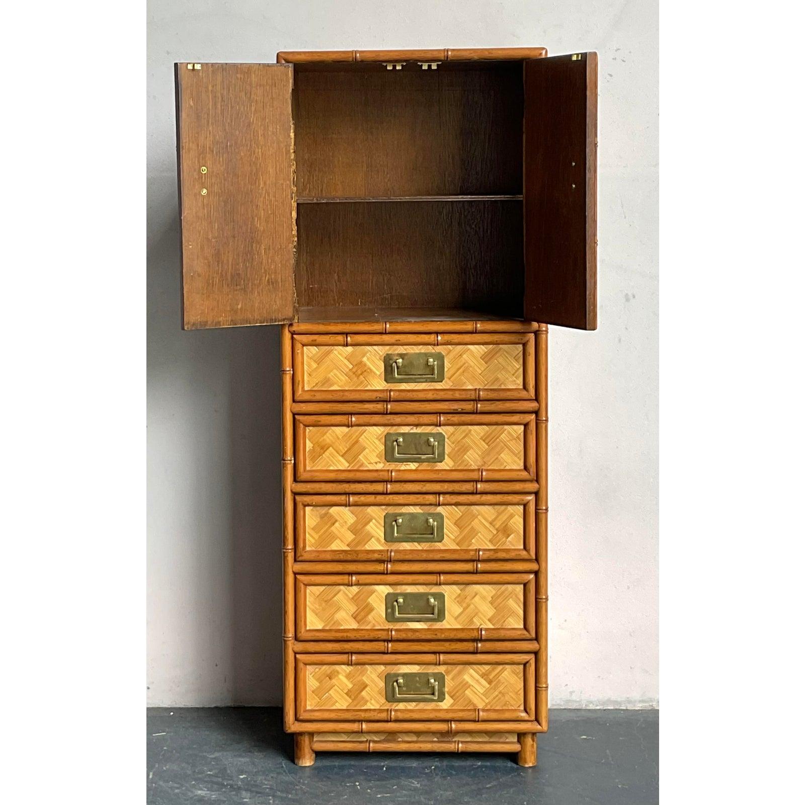 Elevate your interior with this exceptional vintage gentleman's chest, a stunning embodiment of Boho Chic and Chinoiserie aesthetics. Crafted with meticulous detail, the chest features exquisite parquet rattan paneling framed by sturdy bamboo,