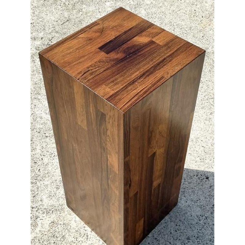 Elevate your favorite sculpture, vase, or lush plant with this handsome vintage parquet wood pedestal. Featuring a clean, minimalist columnar form, its beauty lies in the intricate patchwork of wood grain showcased by the parquet construction,