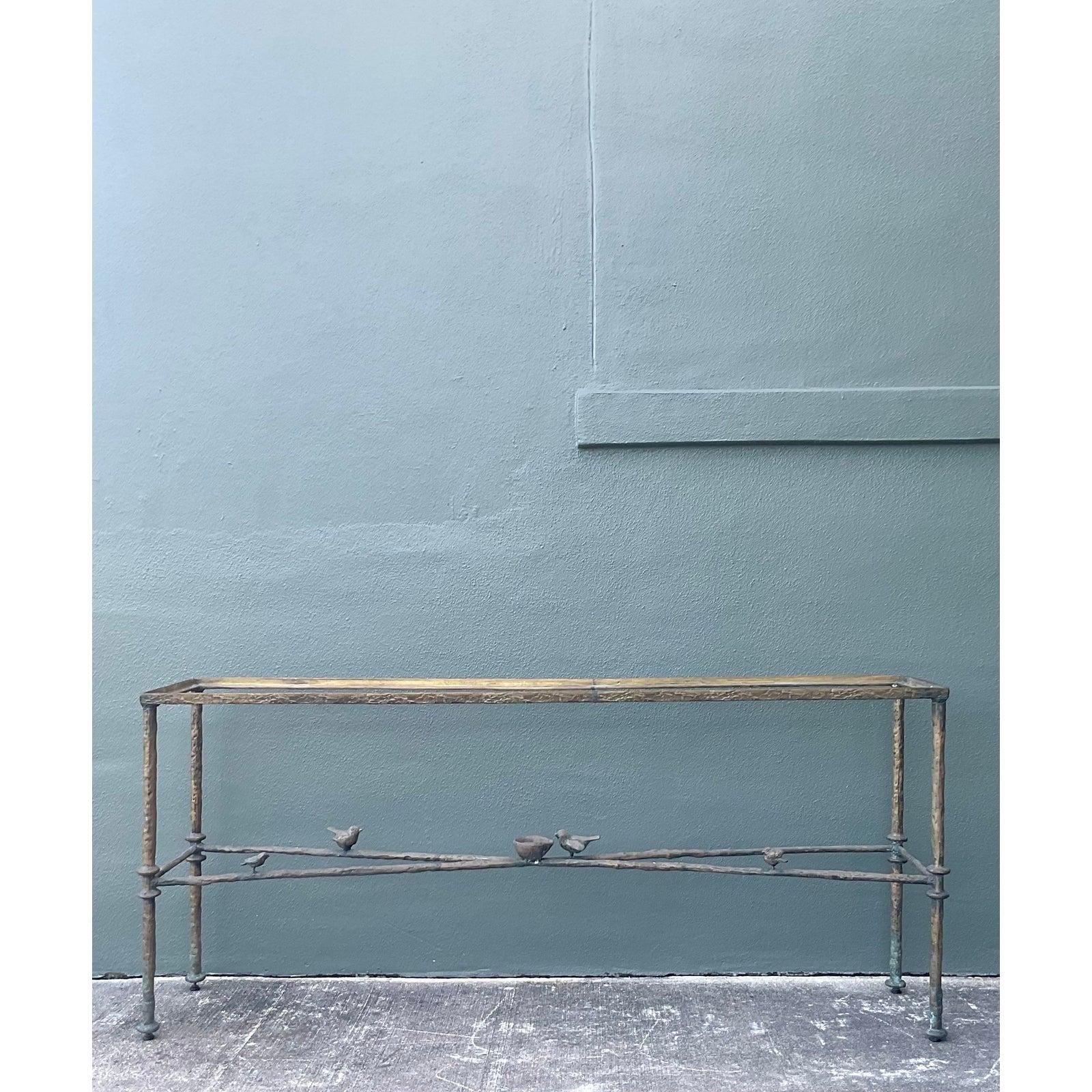 Evoke the sculptural whimsy and organic elegance of Diego Giacometti with this magnificent vintage iron console table. The frame is masterfully crafted to resemble natural tree branches, featuring a heavily textured surface finished in a rich,