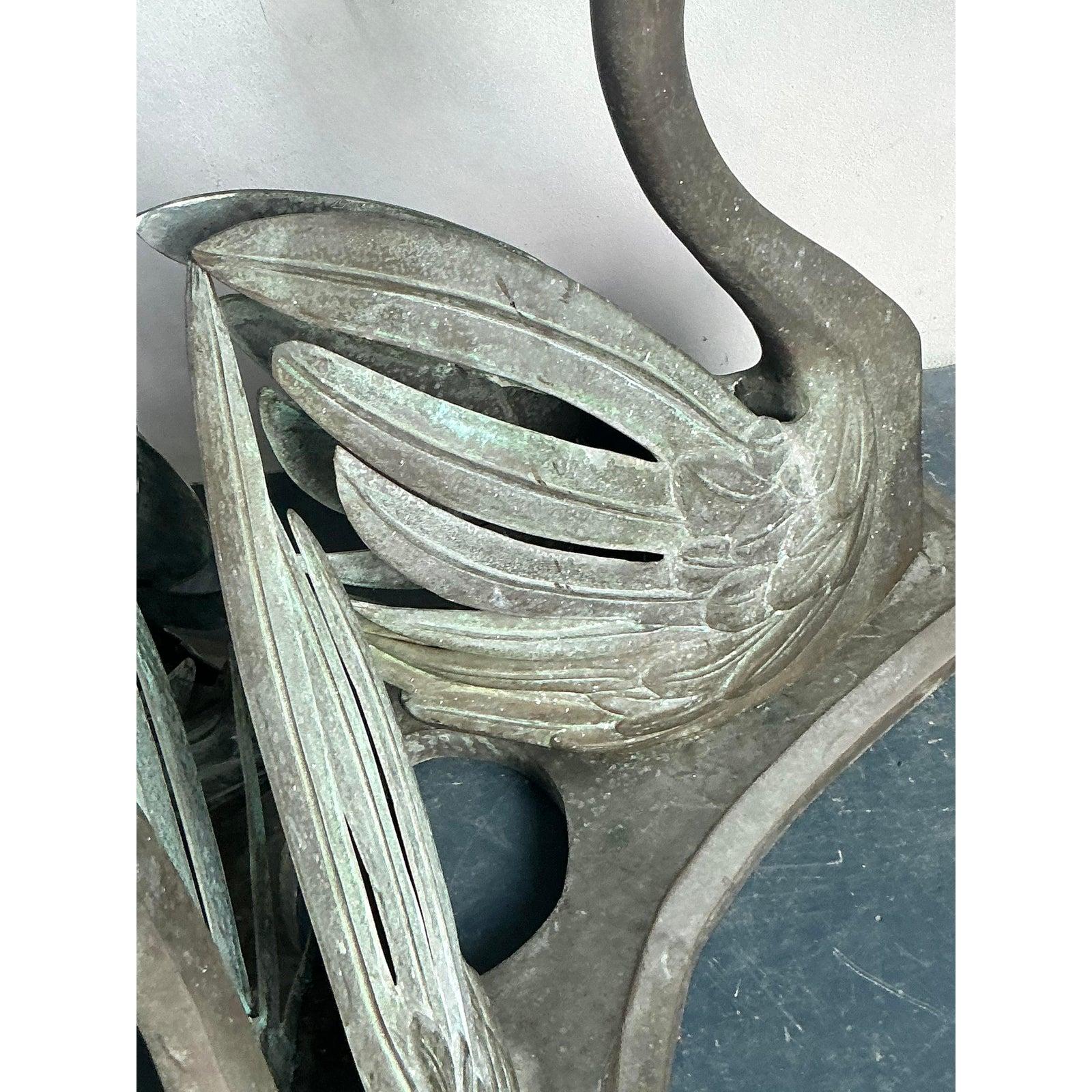 Presenting a truly magnificent vintage table pedestal from the mid-20th century, featuring three gracefully sculpted swans crafted from patinated bronze. This stunning piece exudes a unique blend of bohemian allure and classical elegance, with each