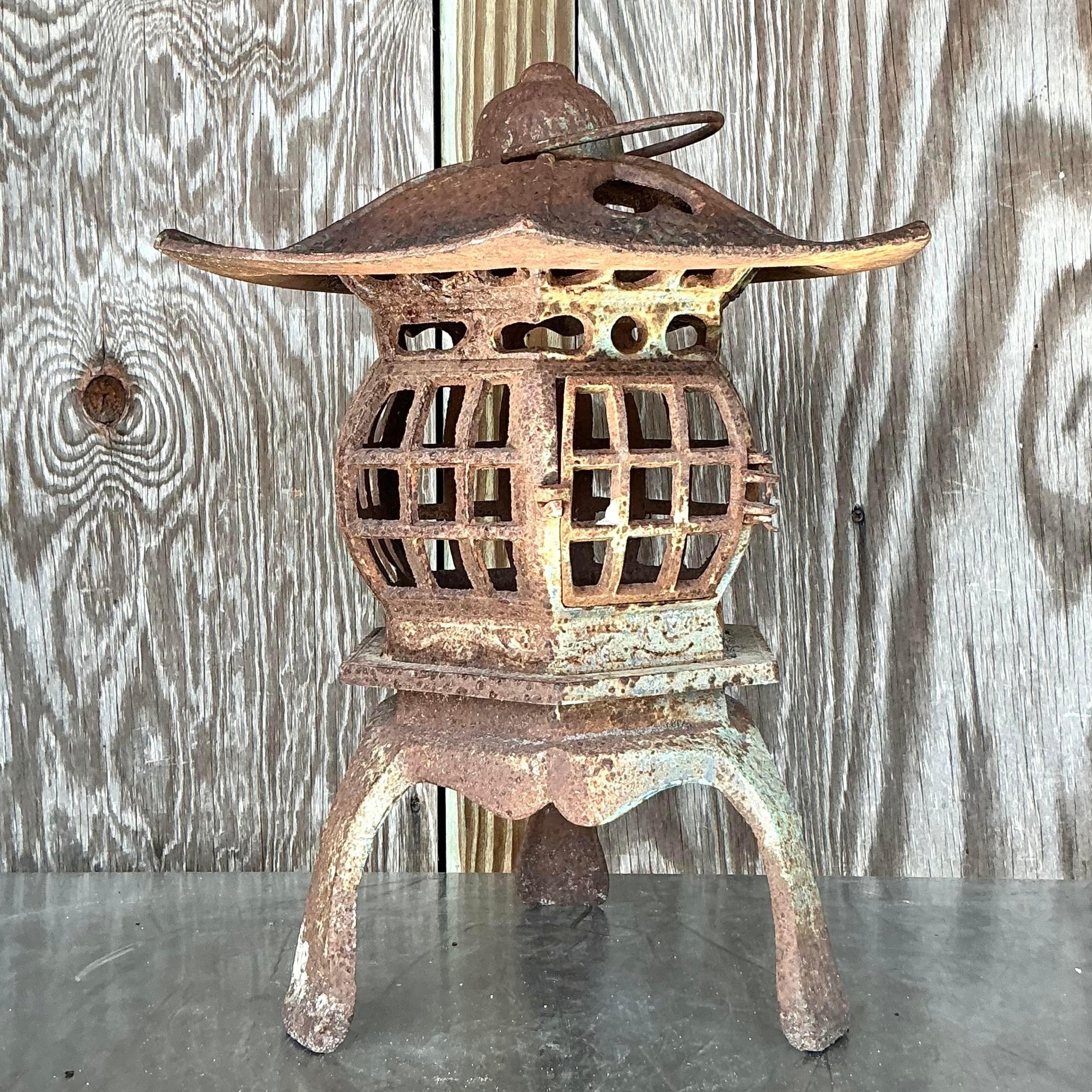 This vintage Boho pagoda lantern, beautifully patinated with an aged finish, captures a sense of timeless, exotic elegance. Its pagoda-inspired silhouette and intricate details make it a captivating decor piece, ideal for adding a warm, ambient glow