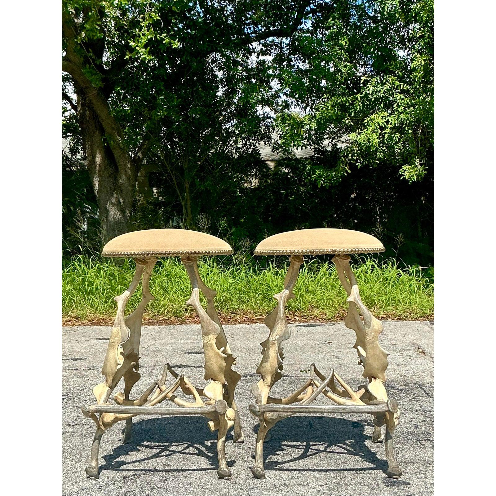Unleash a touch of wild, organic artistry into your interior with this spectacular pair of vintage faux antler stools. Each stool is a masterpiece of sculptural design, featuring a complex, interwoven base that beautifully mimics the gnarled,