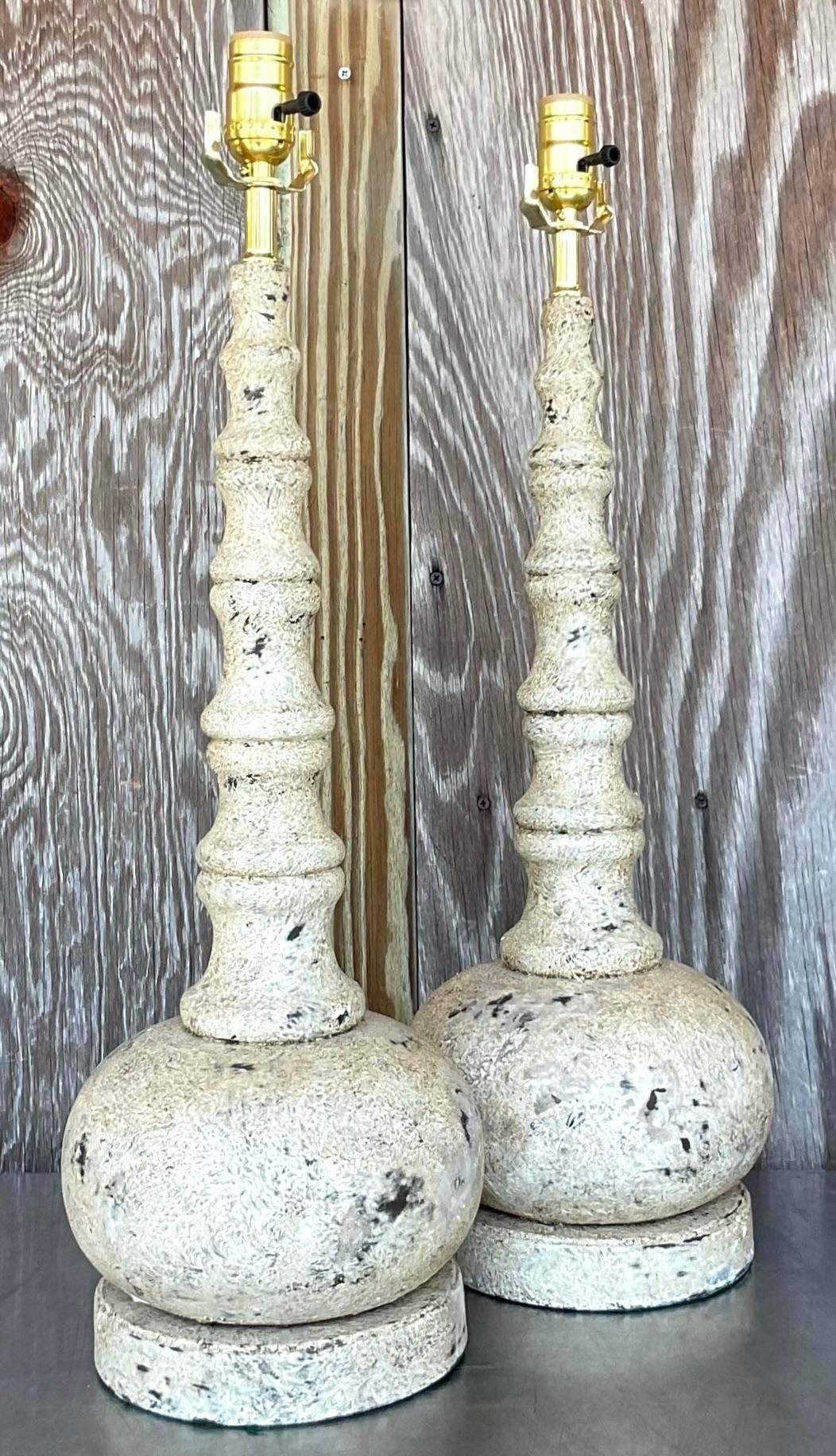 Light up your space with our Vintage Boho Patinated Long Neck Lamps - A Pair. These stylish lamps feature a unique patinated finish and long neck design, blending Bohemian flair with American craftsmanship. A chic duo that adds character and