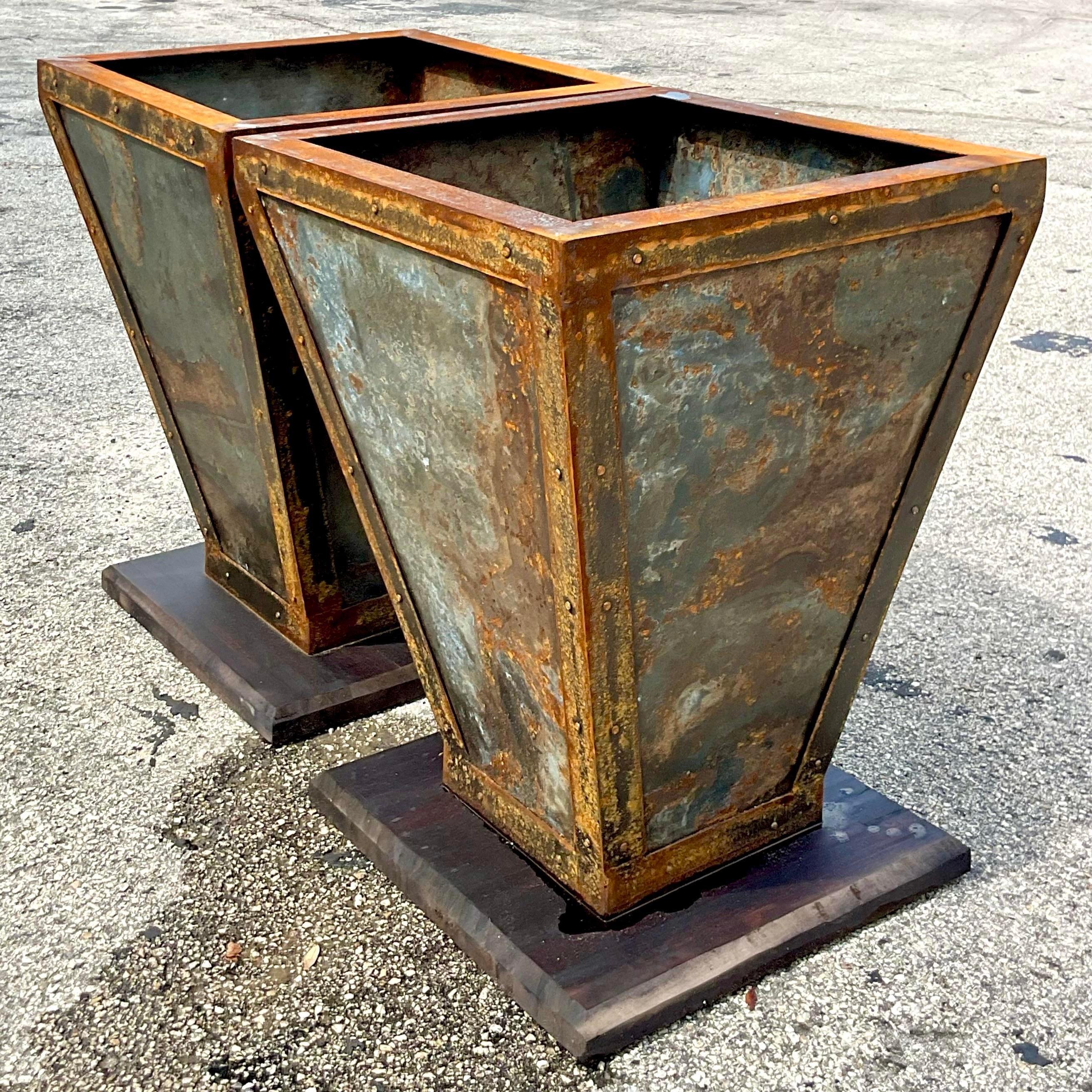 Vintage Boho Patinated Planters on Wooden Plinths - a Pair In Good Condition In west palm beach, FL