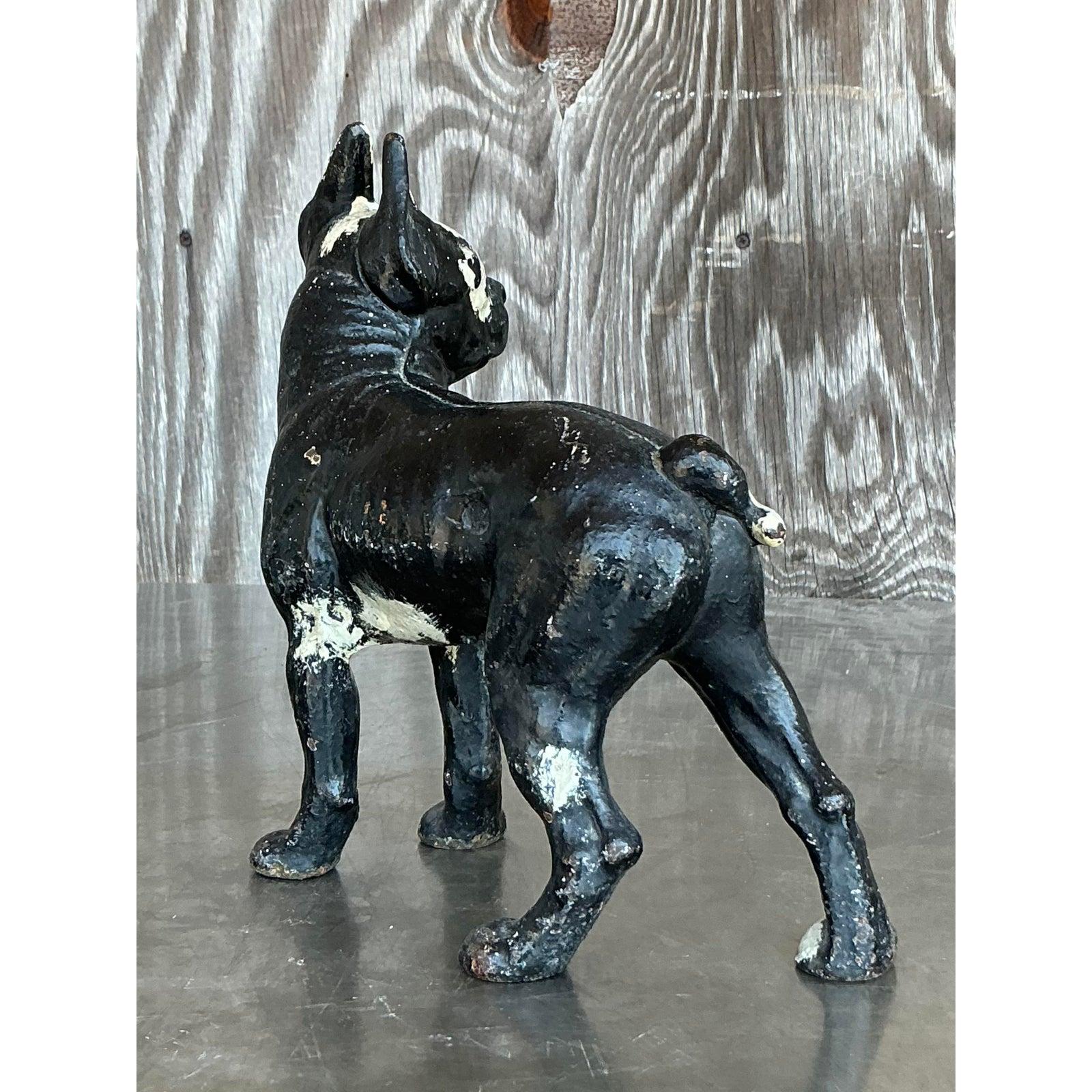 Add vintage charm and a touch of whimsy to your space with this Vintage Boho Patinated Wrought Iron Dog sculpture. Modeled after a classic Boston Terrier or French Bulldog, this sturdy and character-rich piece features a beautifully worn painted