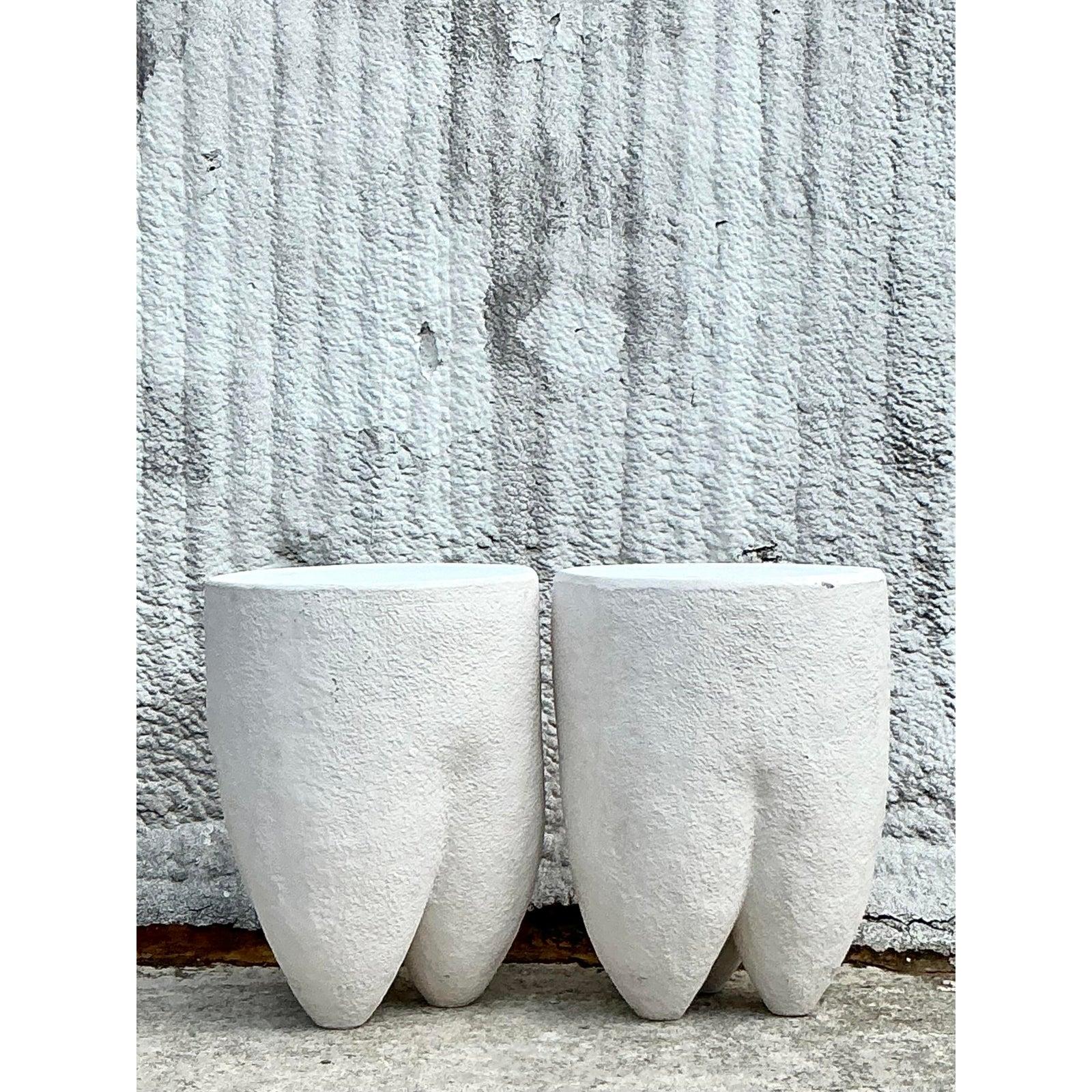 Add a touch of organic elegance to your space with this pair of Vintage Boho Pebbled Biomorphic Low Stools, where sculptural design meets bohemian charm. Crafted with a textured, pebbled finish in a soft white hue, these stools feature a unique