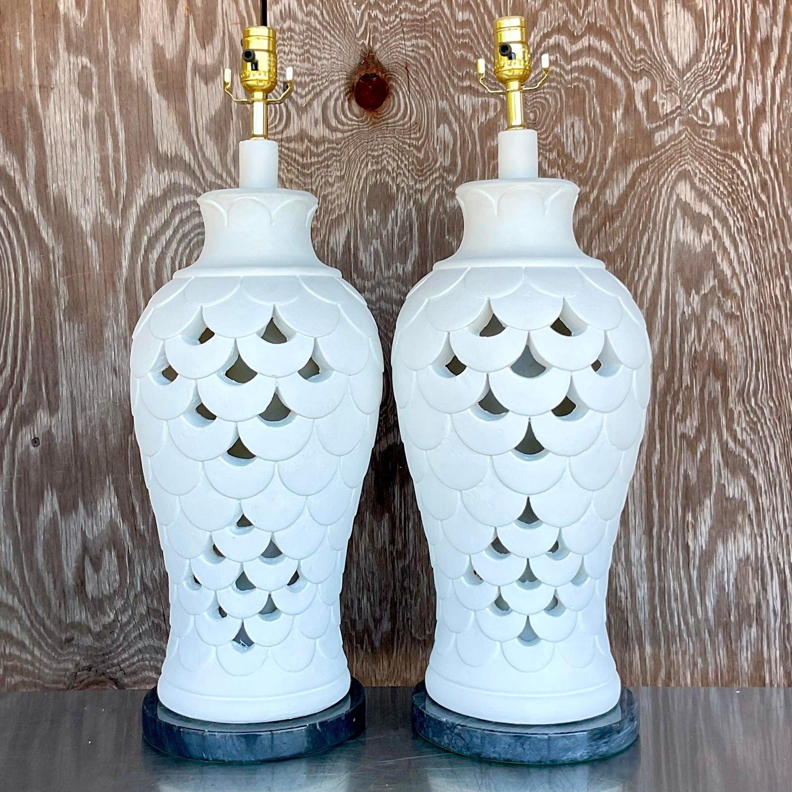 A fabulous pair of vintage Boho table lamps. A chic plaster body with an open trellis design. Rest on a black marble plinth. Fully restored with all new wiring and hardware. Acquired from a Palm Beach estate.