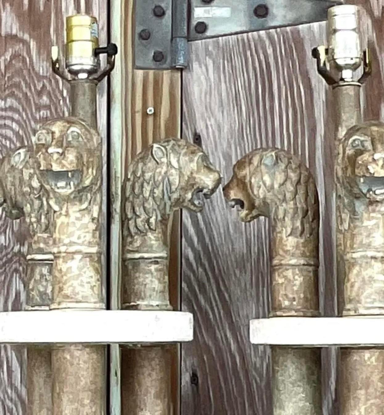 Enhance your space with the regal charm of this pair of Vintage Boho Plaster Lions Head Lamps on Coquina Plinths. These American-style lamps feature intricately crafted plaster lion heads atop natural coquina stone bases, blending bohemian elegance