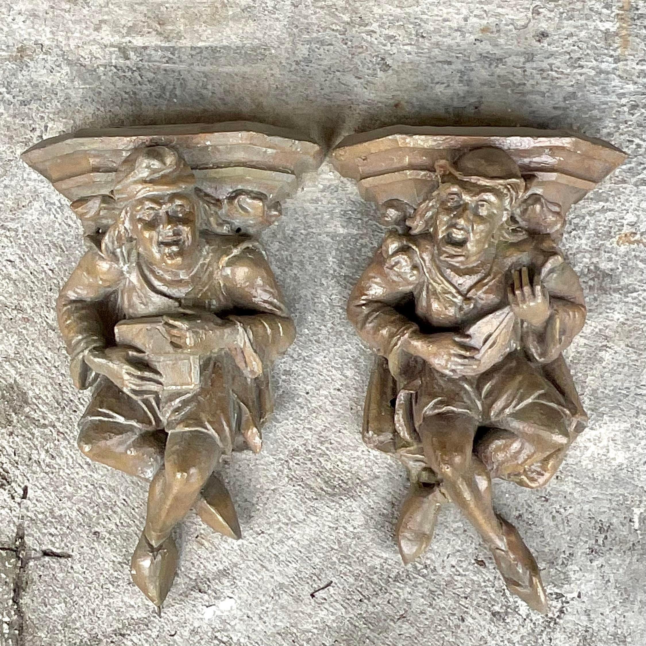 A stunning set of vintage Boho wall brackets. A chic pair of minstrels with their instruments. A plaster construction with a lacquered finish. Acquired from a Palm Beach estate
