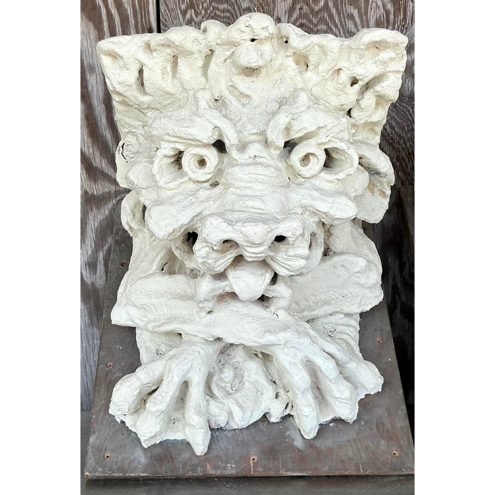 Infuse your space with a touch of architectural intrigue and whimsical Gothic charm with this striking pair of vintage gargoyle corbels. Crafted from plaster over a fiberglass core for a substantial yet manageable form, these expressive figures