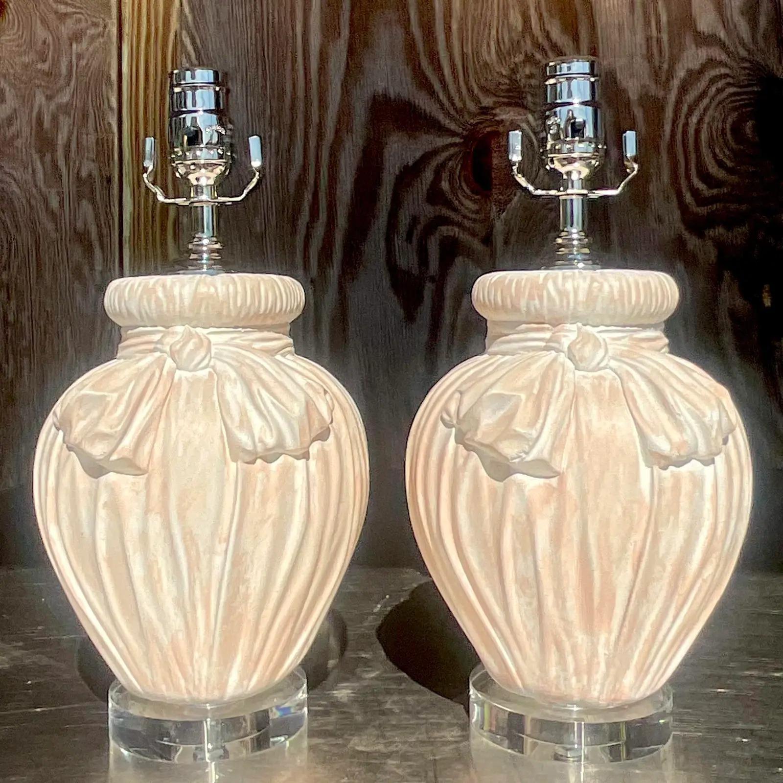 The most stunning pair of vintage plaster table lamps. A beautiful tied bow design in a chic cerused finish. Fully restored with all new wiring, hardware and lucite plinths. Acquired from a Palm Beach estate.