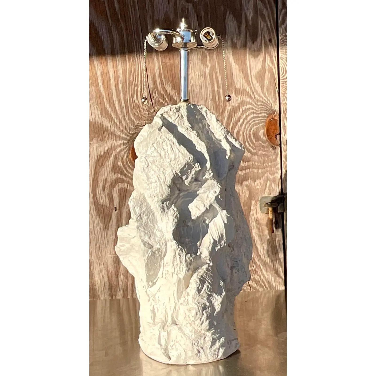A fantastic vintage Boho table lamps. A chic angled rock formation done in white plaster. Fully restored with all new wiring and polished wood hardware. Acquired from a Palm Beach estate. 