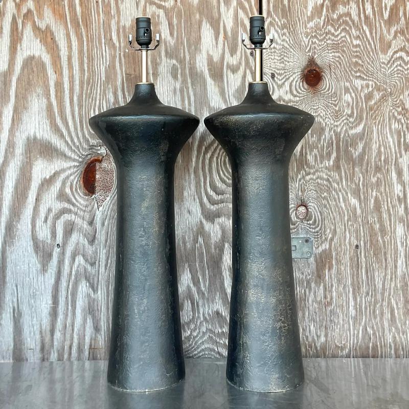 A sensational pair of vintage Boho table lamps. Tall and dramatic in size and color. Molded fiberglass with a textured plaster finish. Acquired from a Palm Beach estate.
