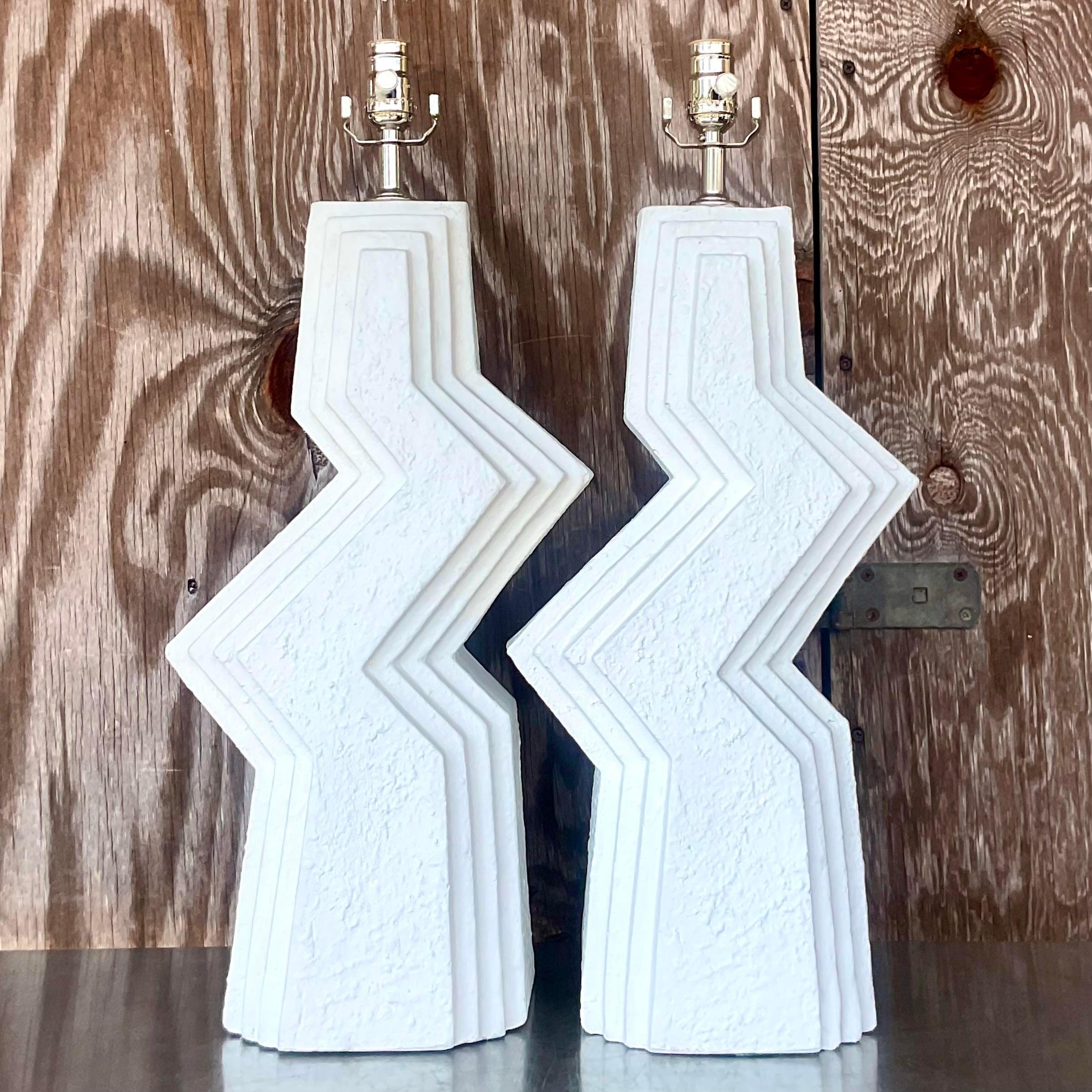 A fabulous pair of vintage 1880s table lamps. A chic zig zag design in a bright white finish. Fully restored with all new hardware and wiring. Acquired from a Palm Beach estate.