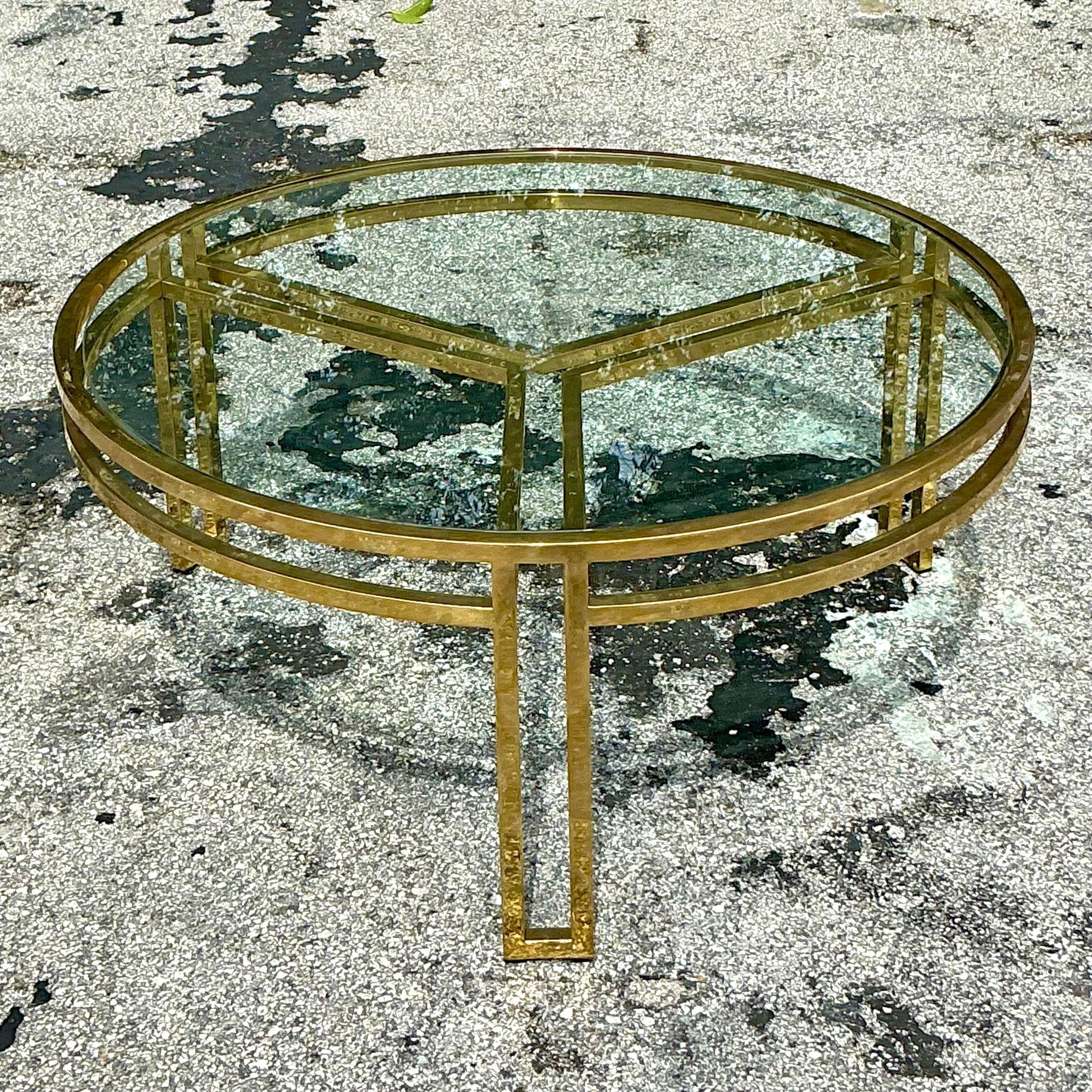 Elevate your living room with this vintage boho polished brass rail coffee table. Its sleek brass frame and stylish rail design offer a perfect blend of bohemian charm and modern elegance. Ideal for showcasing your favorite decor pieces or enjoying