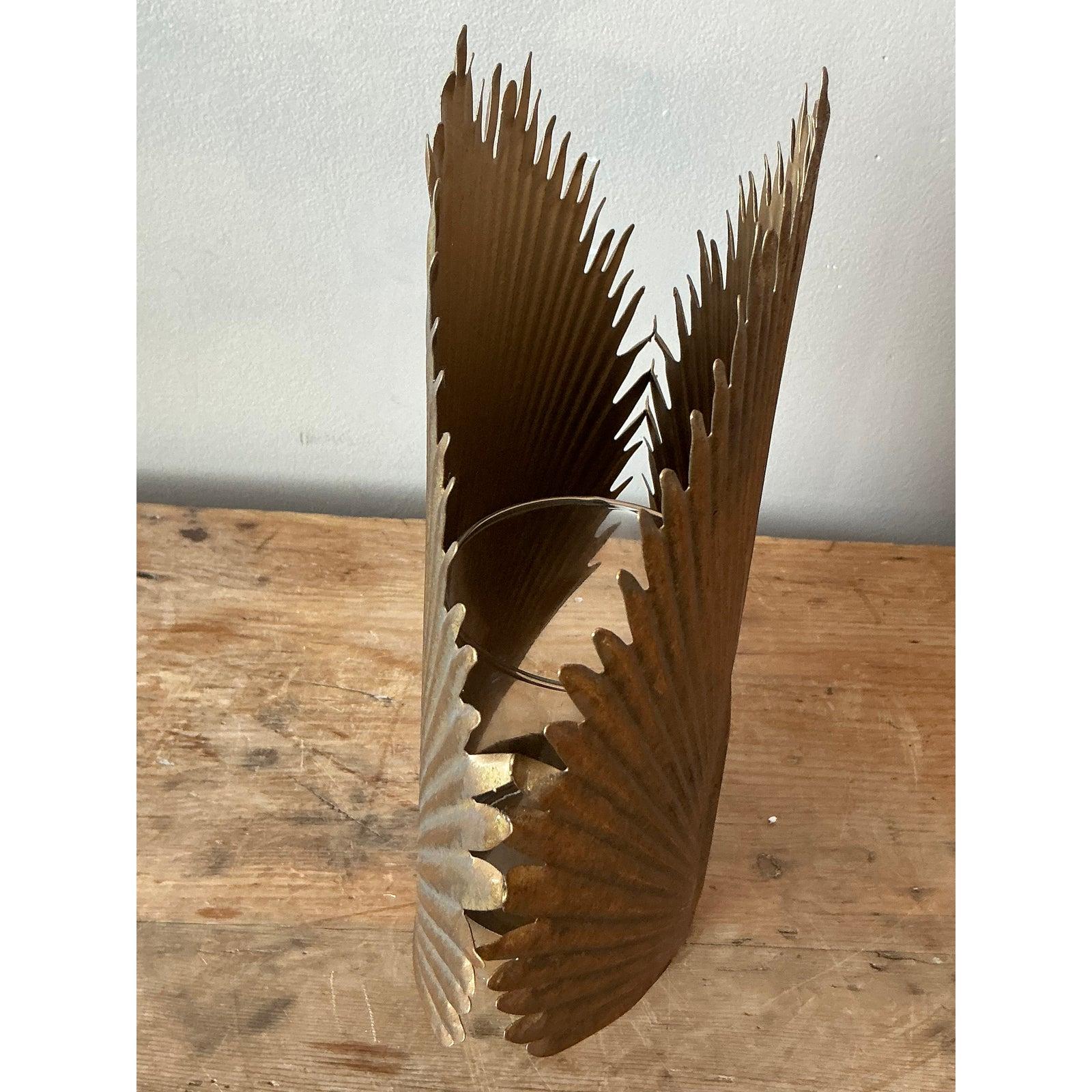 Evoke the glamour of a bygone era with this exquisite vintage pressed brass palm frond decorative piece, perfectly blending Hollywood Regency opulence with a touch of Boho elegance. Crafted in the 1970s, this sculptural object features finely