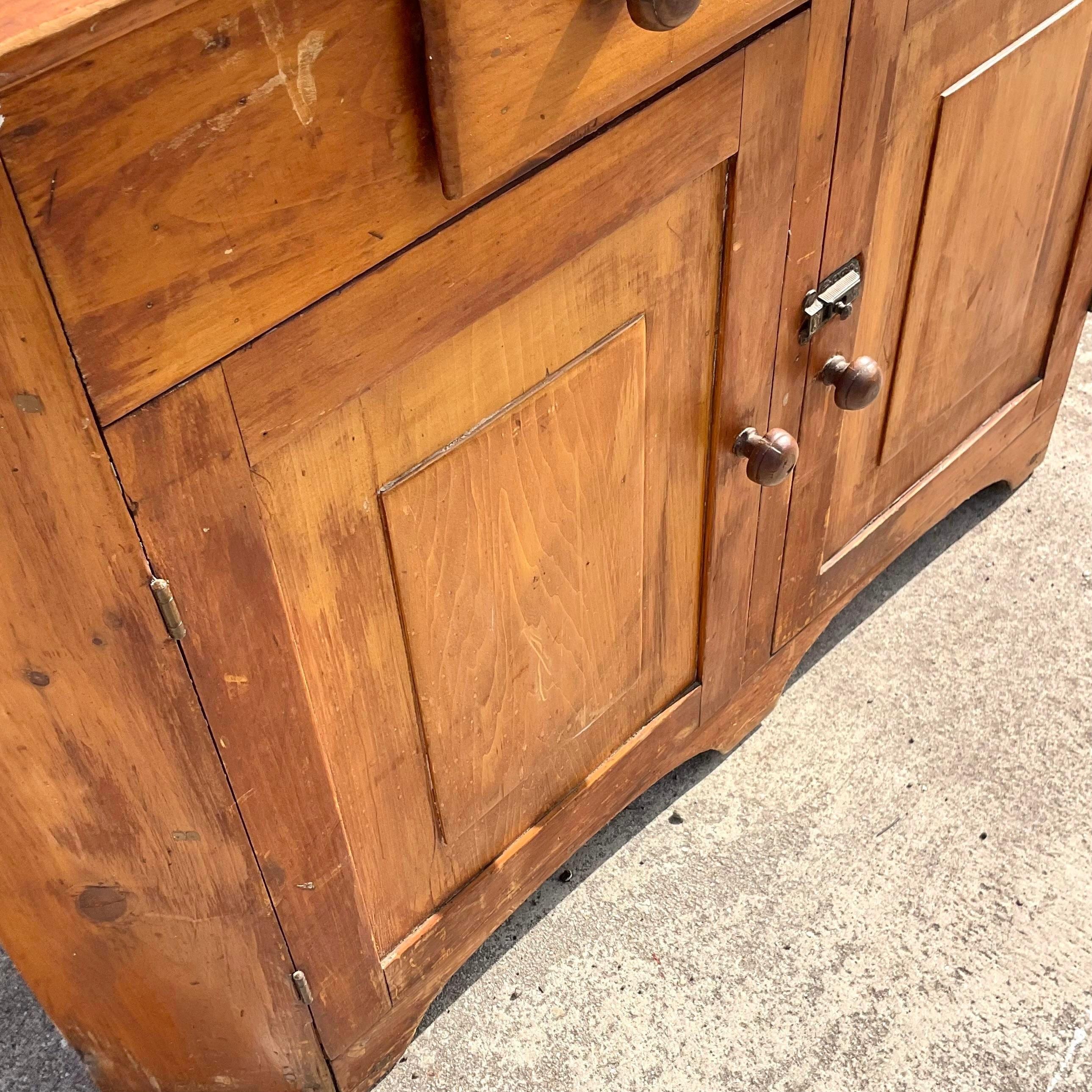 A stunning vintage Boho corner cabinet. An incredible 1800s design with a gorgeous patina from time. Lots of great storage below. Acquired from a Palm Beach estate.