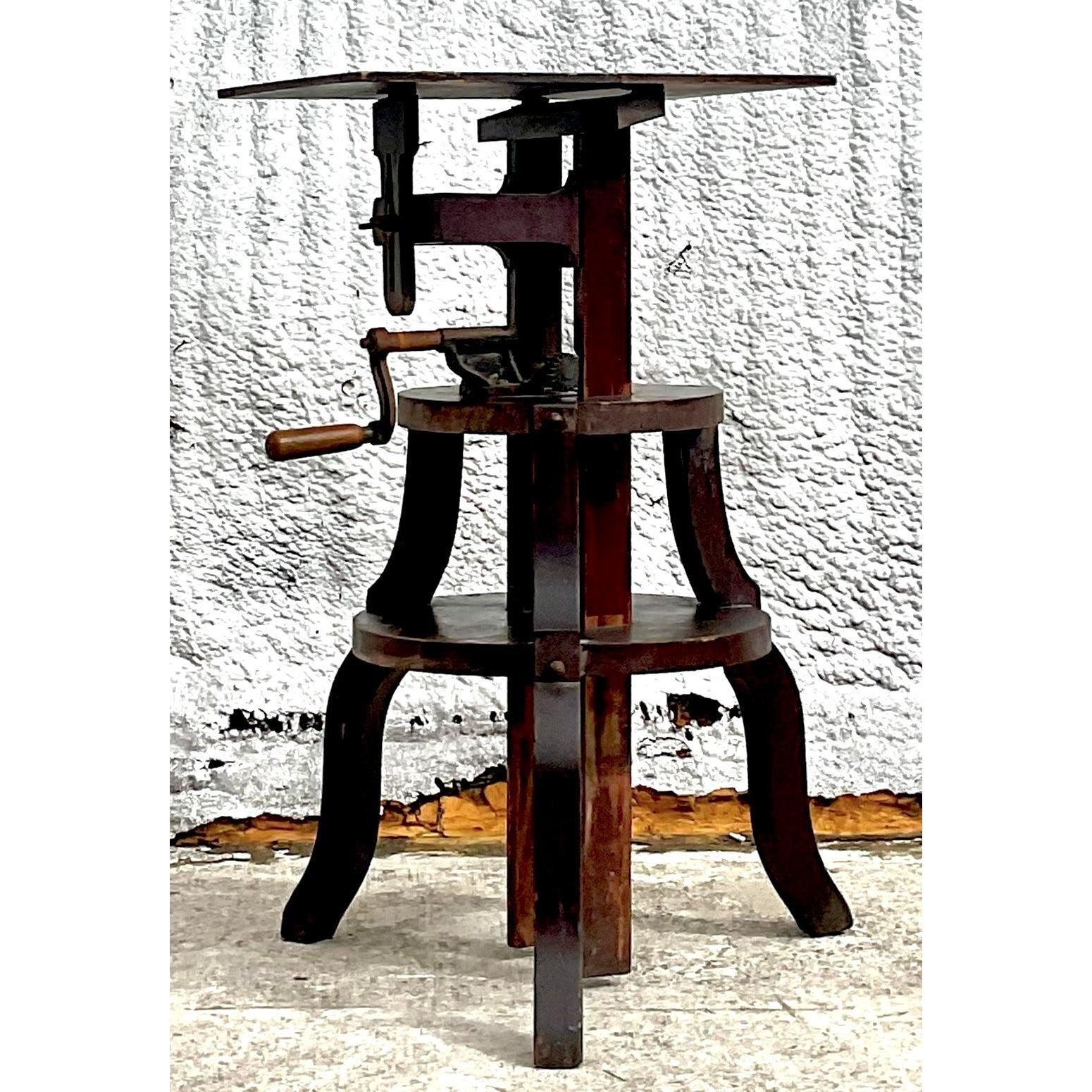 Transport your interior to the atmosphere of a turn-of-the-century atelier with this magnificent vintage sculptor’s stand. A stunning example of functional industrial design, this piece features a robust wooden tripod base and a heavy-duty manual