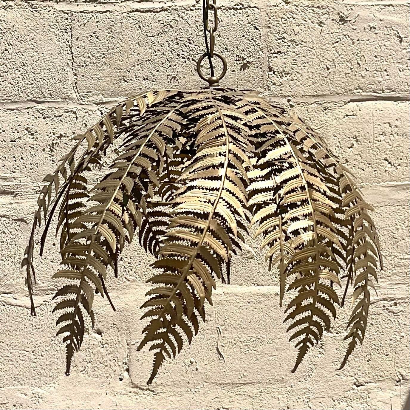 A fabulous vintage Boho chandelier. Chic punch cut metal in a fern design. Matte gold finish. Acquired from a Hamptons estate.